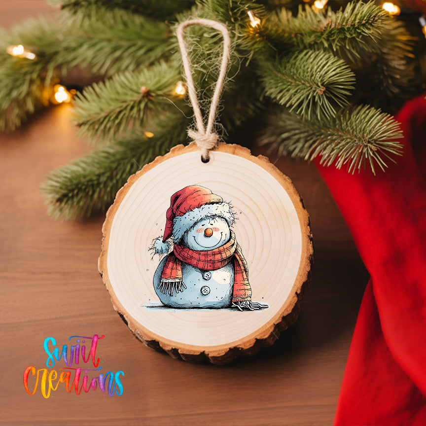 A wooden ornament featuring a snowman is hanging on a Christmas tree, with a red cloth visible in the background.