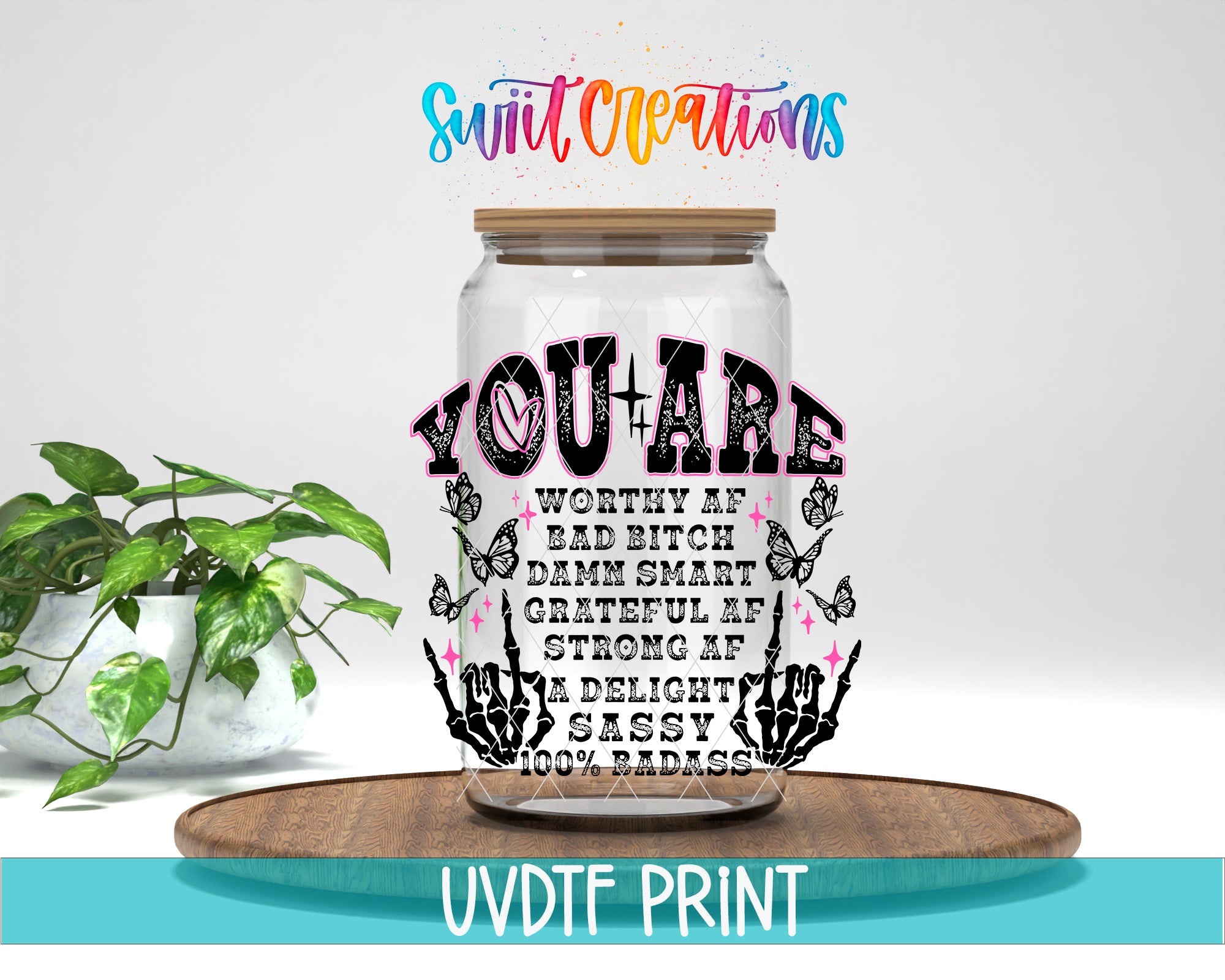 a glass jar with a message written on it, placed on a wooden surface.