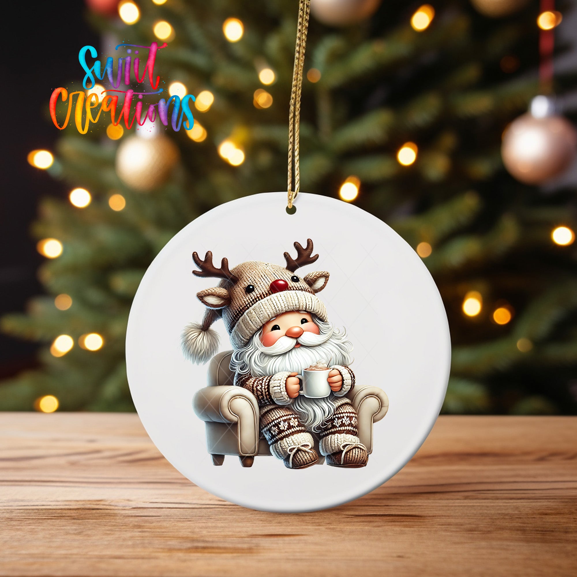 A white ornament featuring a cartoon Santa Claus sitting in a chair, holding a cup of coffee, with a Christmas tree in the background.
