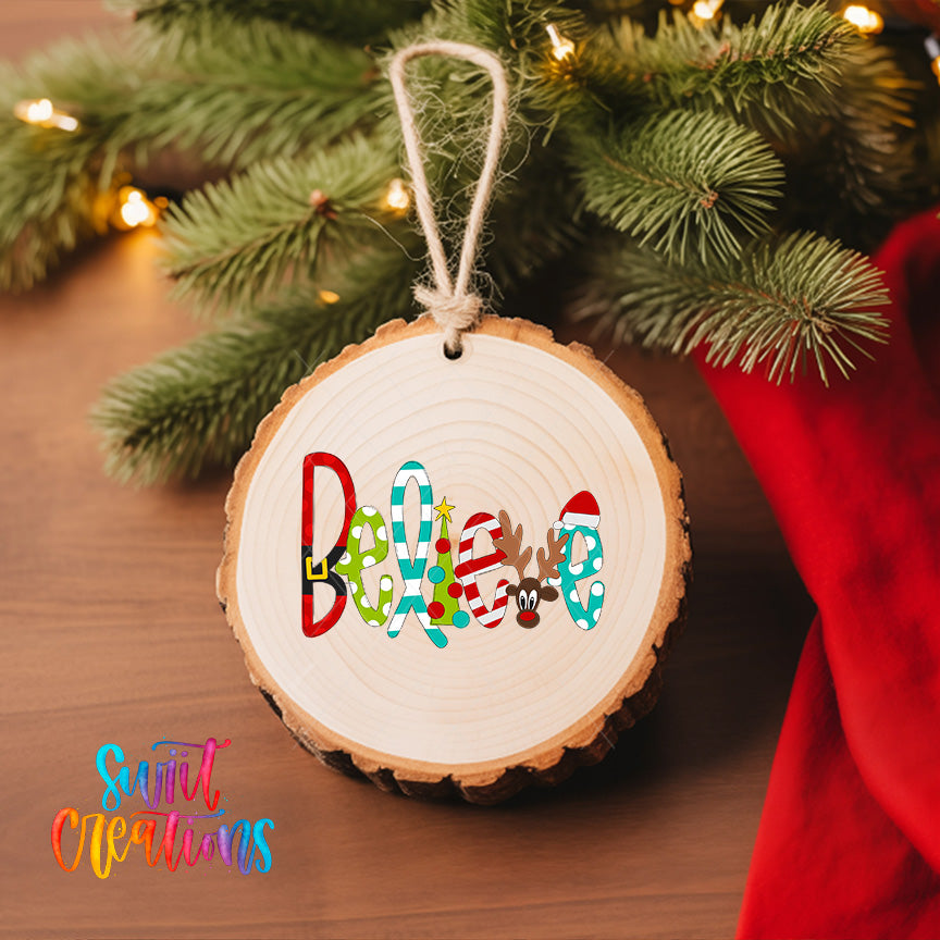 A wooden ornament with the word "Believe" written on it, hanging on a Christmas tree.