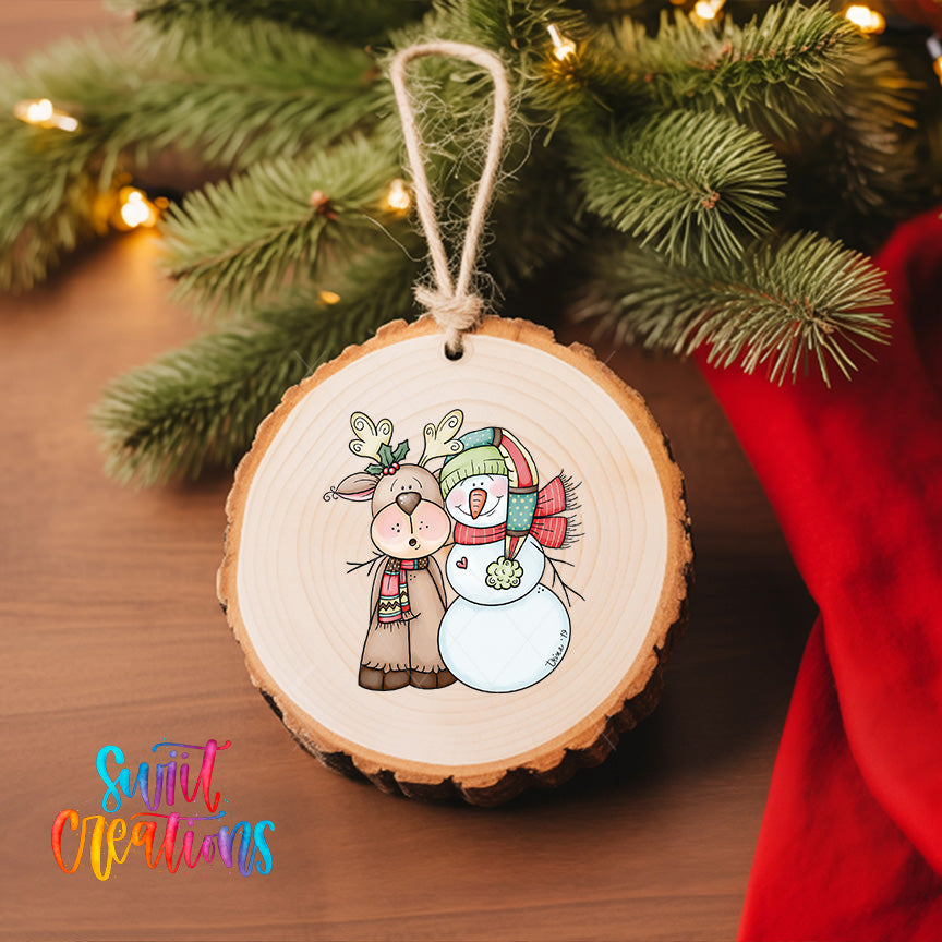 A wooden ornament featuring a reindeer and a snowman, hanging on a Christmas tree.