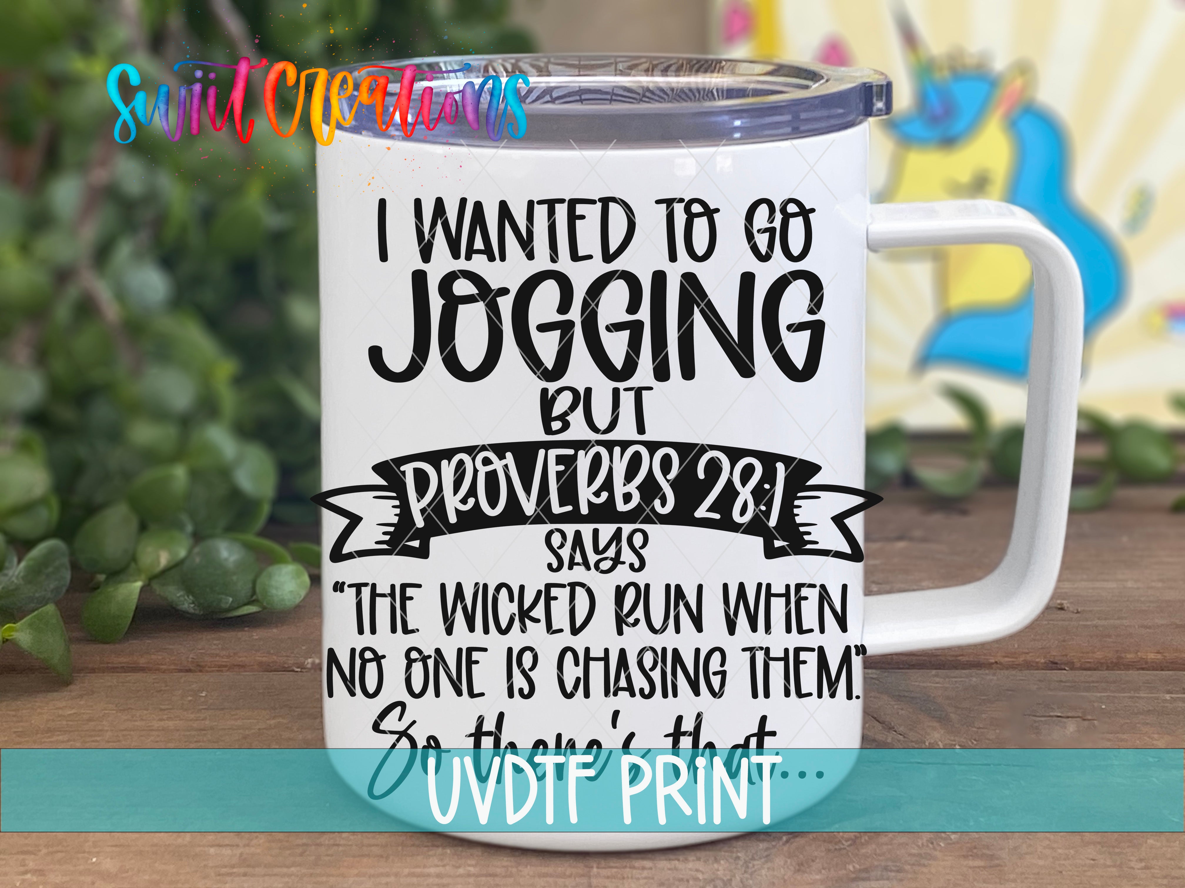 A white mug with a humorous text printed on it, placed on a wooden surface with a blurred background.