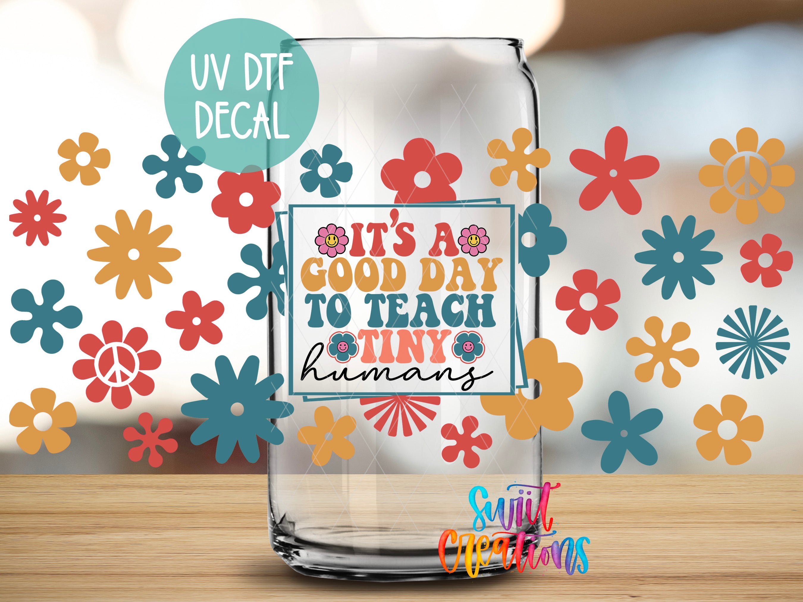 a clear glass jar with a UV decal on it, surrounded by colorful flower decals.