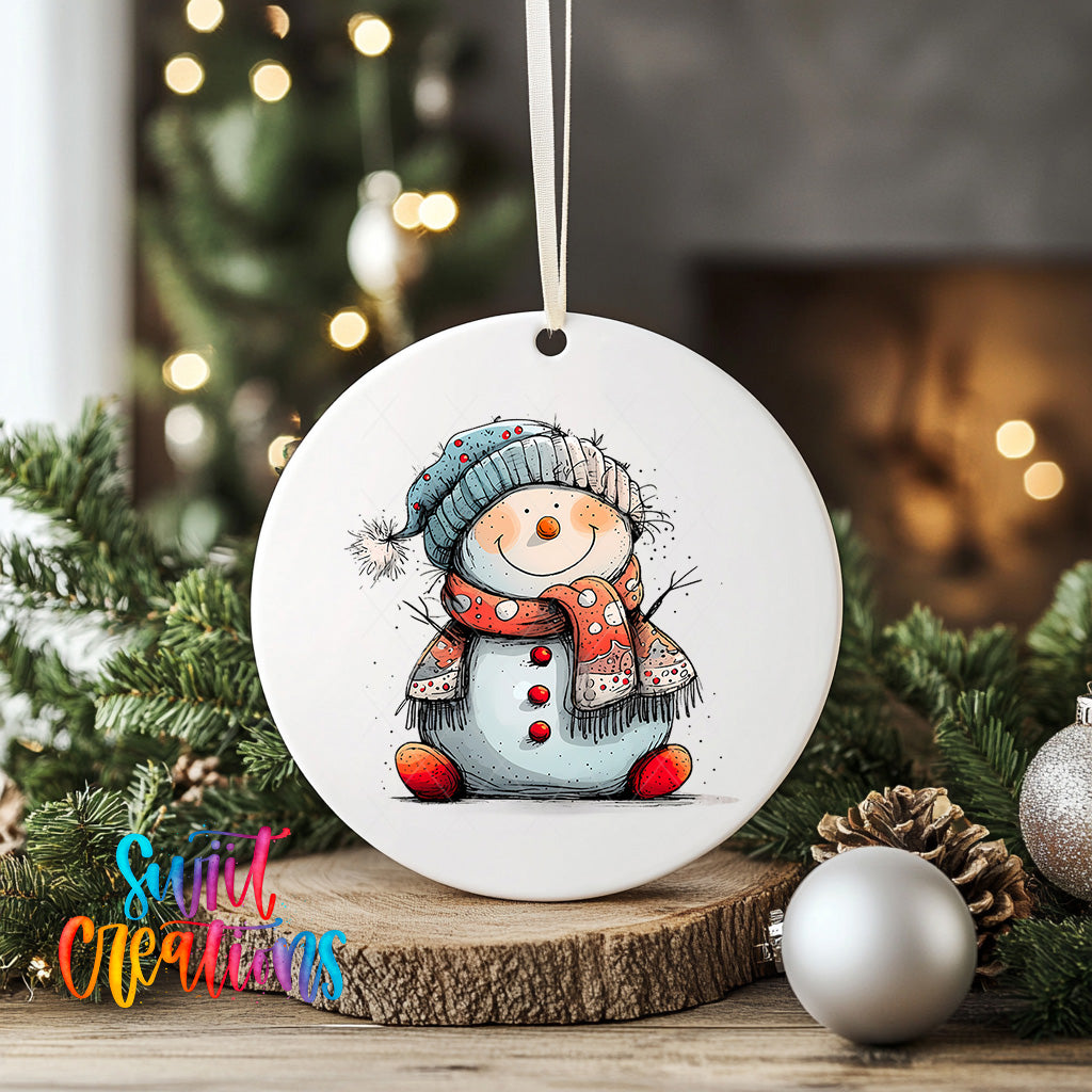A white ceramic ornament featuring a cheerful snowman with a scarf and hat, surrounded by Christmas decorations and greenery.