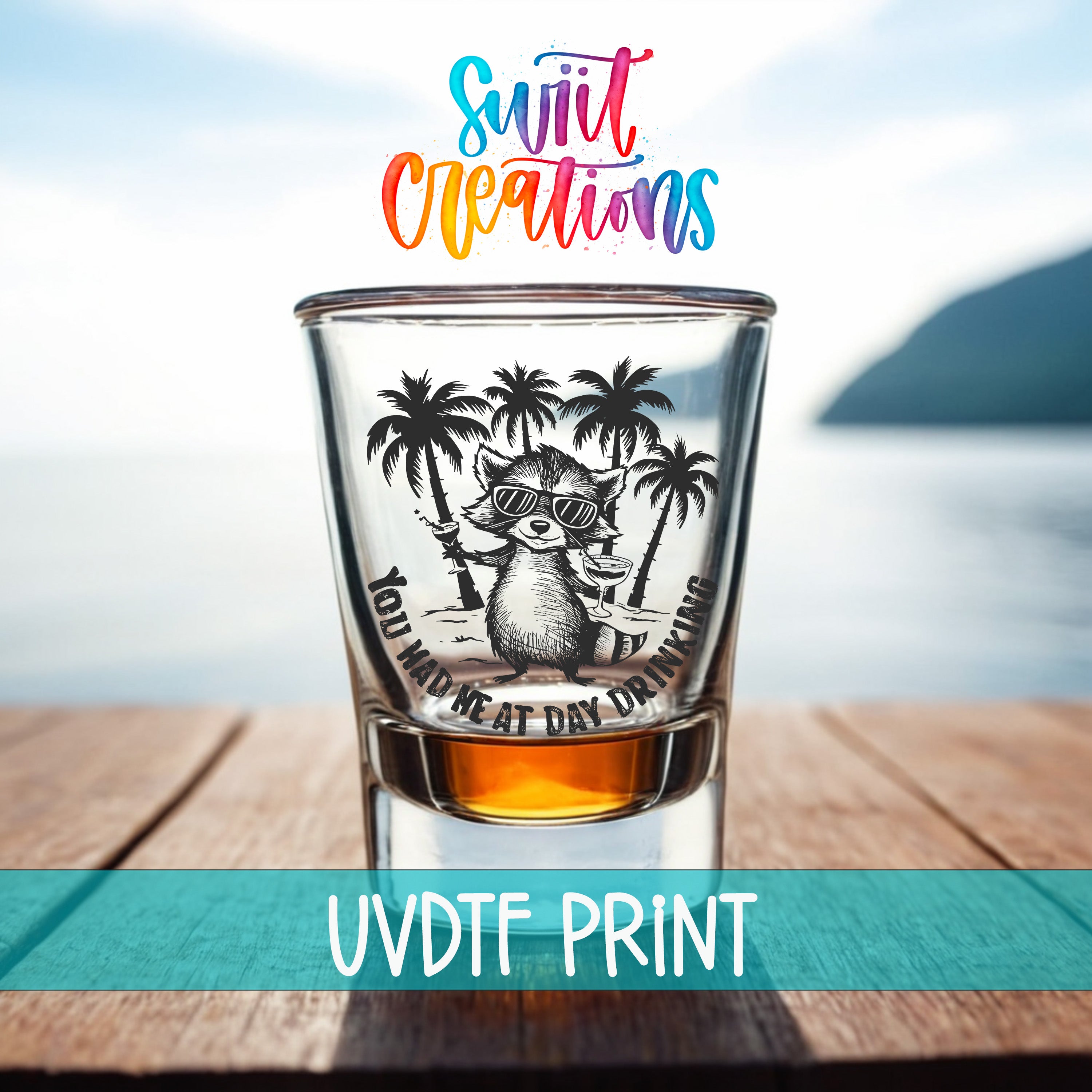 A shot glass with a cartoon raccoon wearing sunglasses and holding a drink, set against a beach background with palm trees.