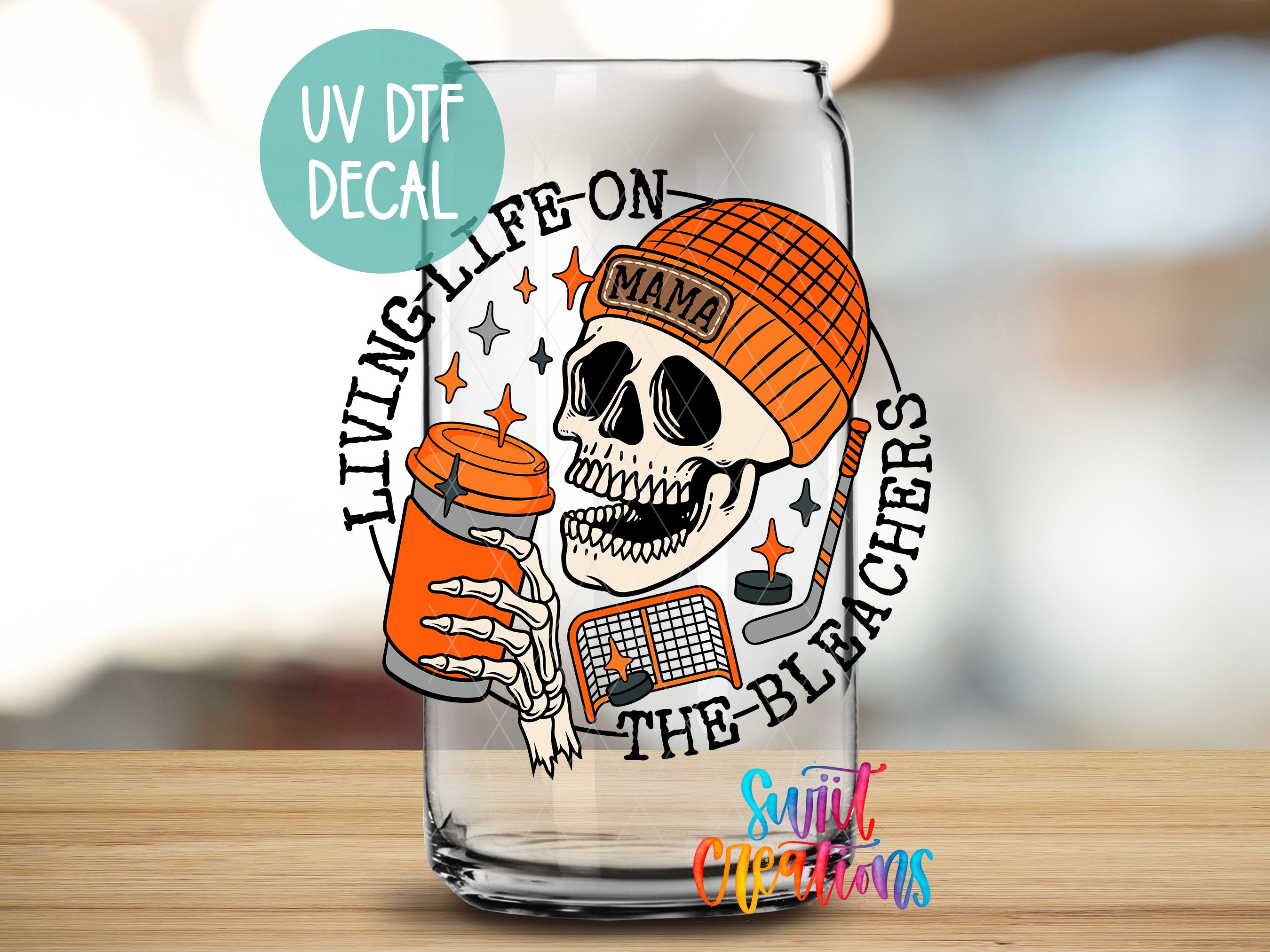 a shot glass with a skull holding a bottle