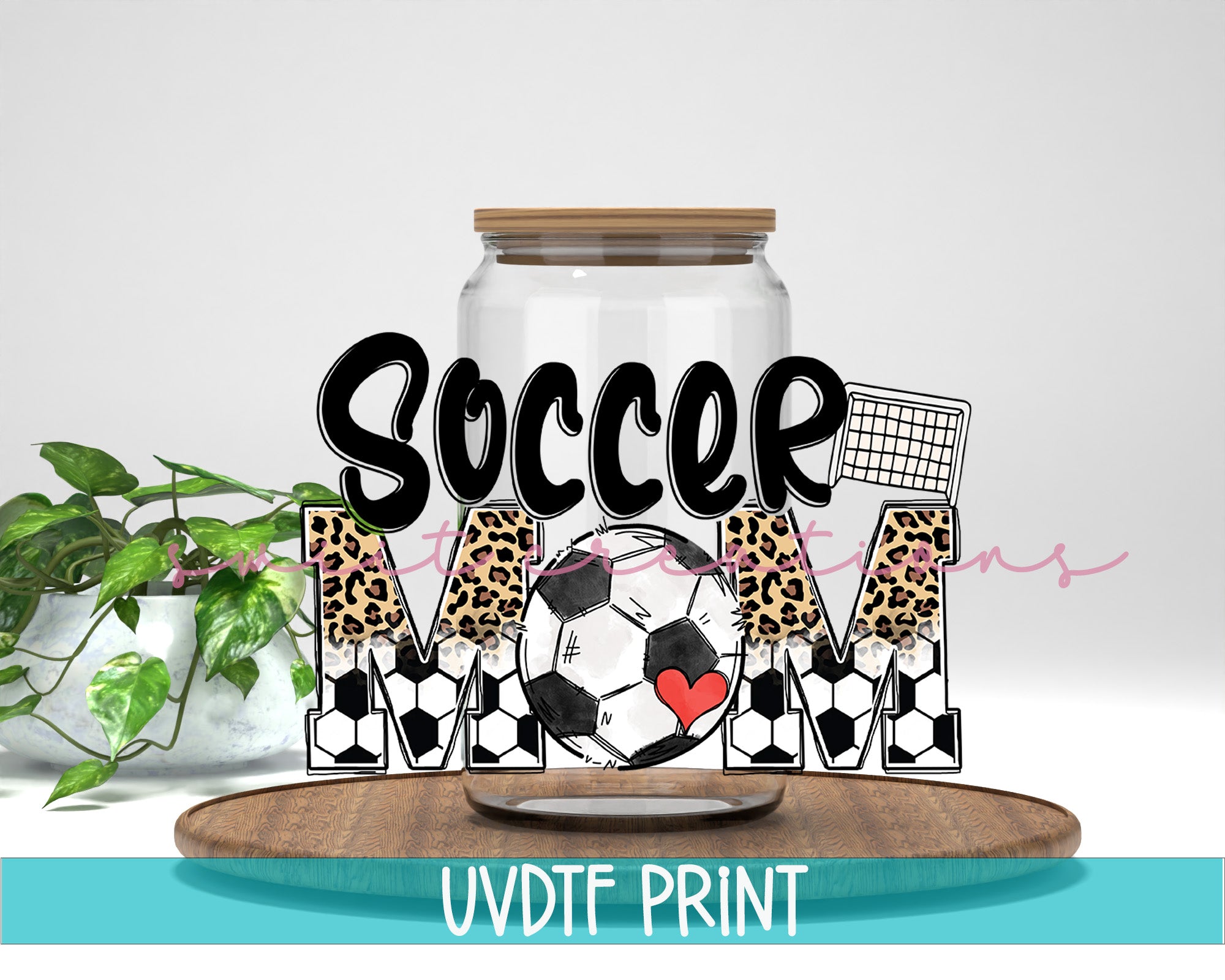 a glass jar filled with a soccer ball on top of a wooden table