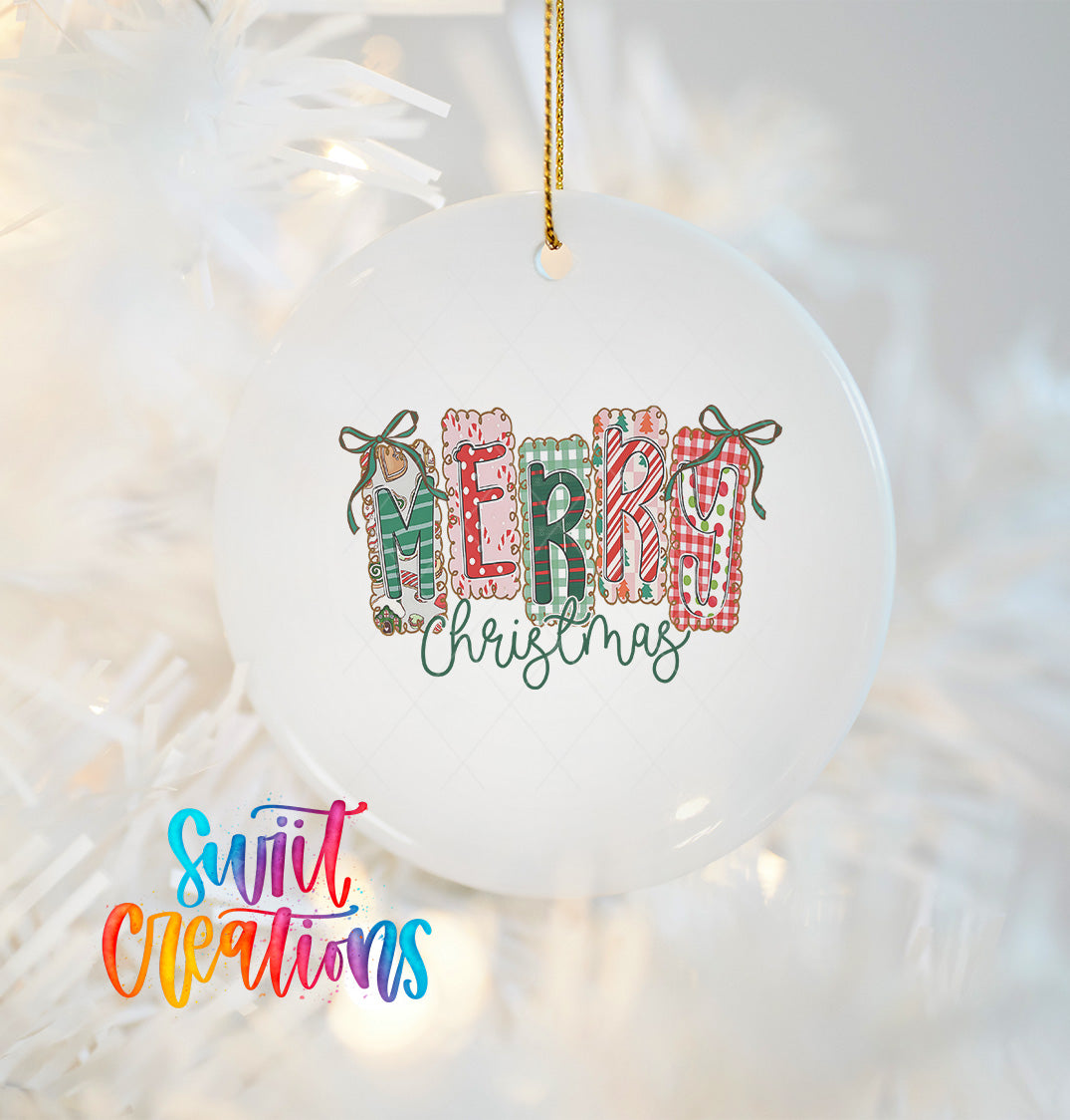 A white Christmas ornament with the word "MERRY" written in colorful letters, hanging on a tree.