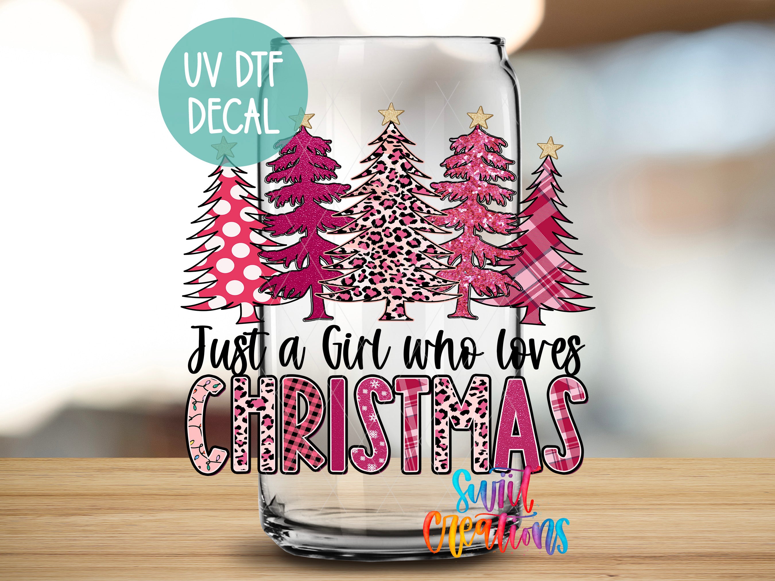 A glass jar with a Christmas tree decal on it, featuring a text overlay that says "Just a Girl who loves Christmas".