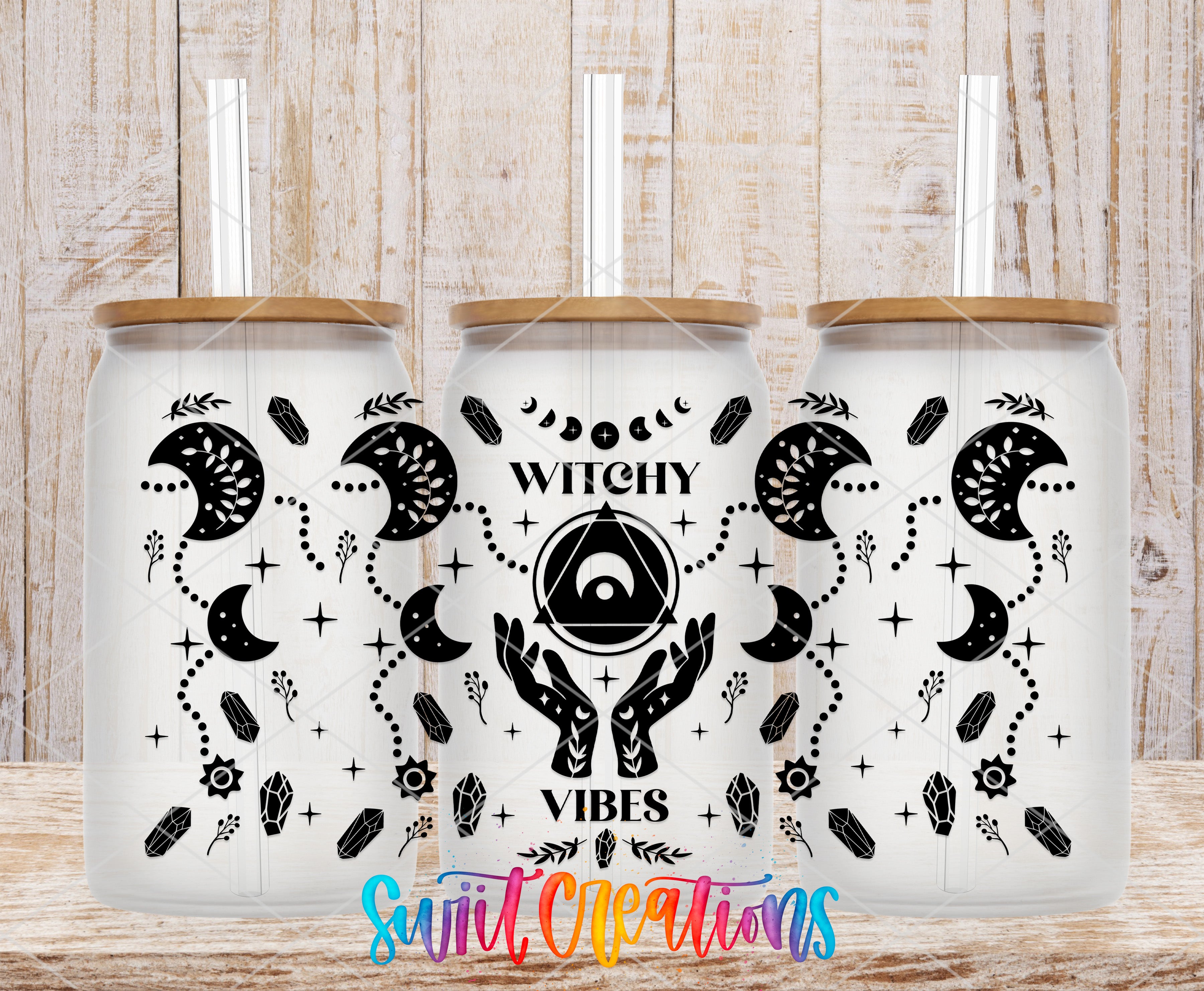 three white tumblers with black designs and text, including the words "Witchy Vibes" and "Witchy Vibes" written in a stylized font.