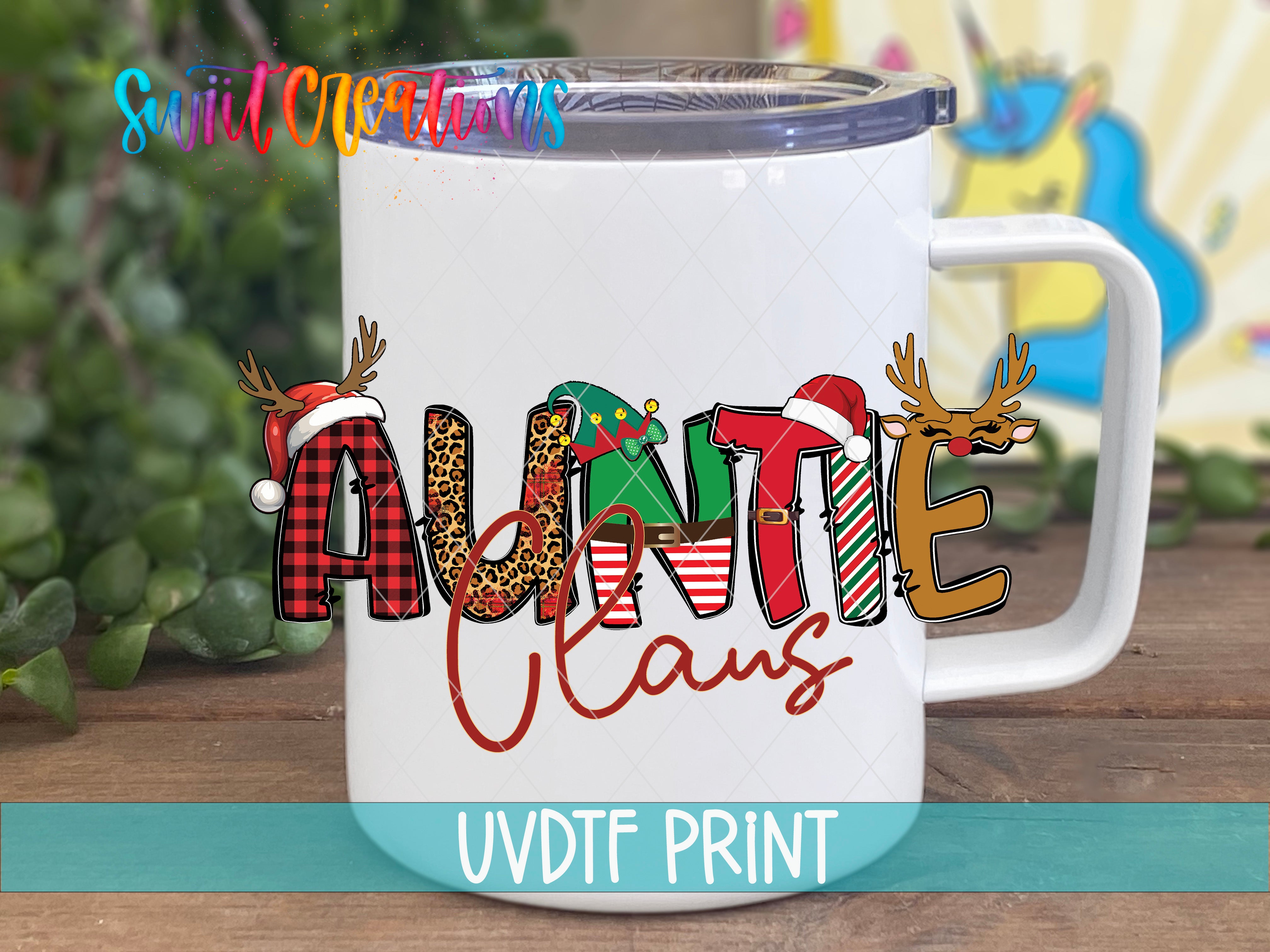 A white mug with a colorful design featuring the word "Auntie Claus" and various holiday-themed elements such as reindeer and snowflakes.