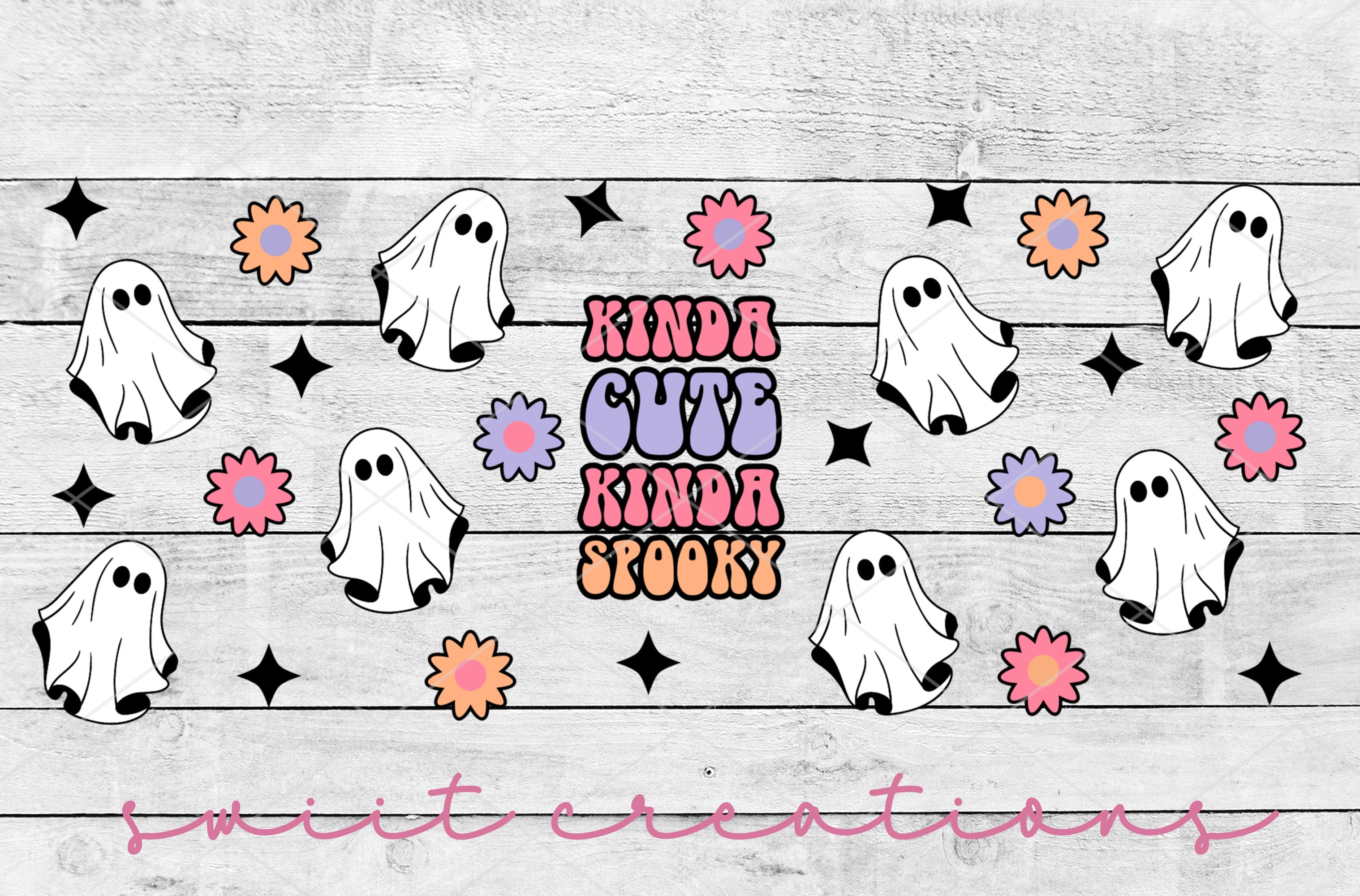 a group of ghost stickers on a wooden surface