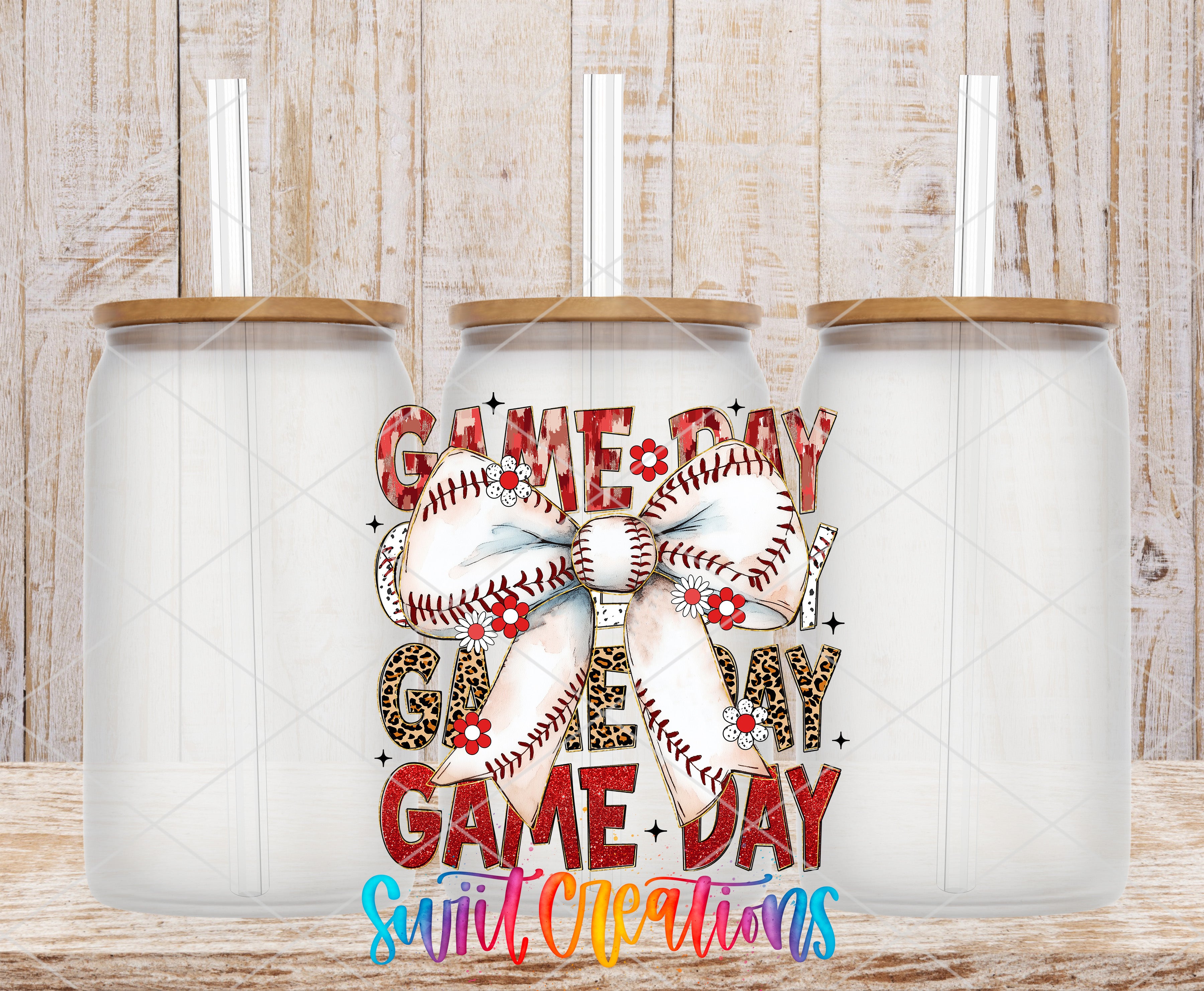 three glass tumblers with a baseball-themed design on them, including a large bow and the text "GAME DAY" and "Suit, Creations".