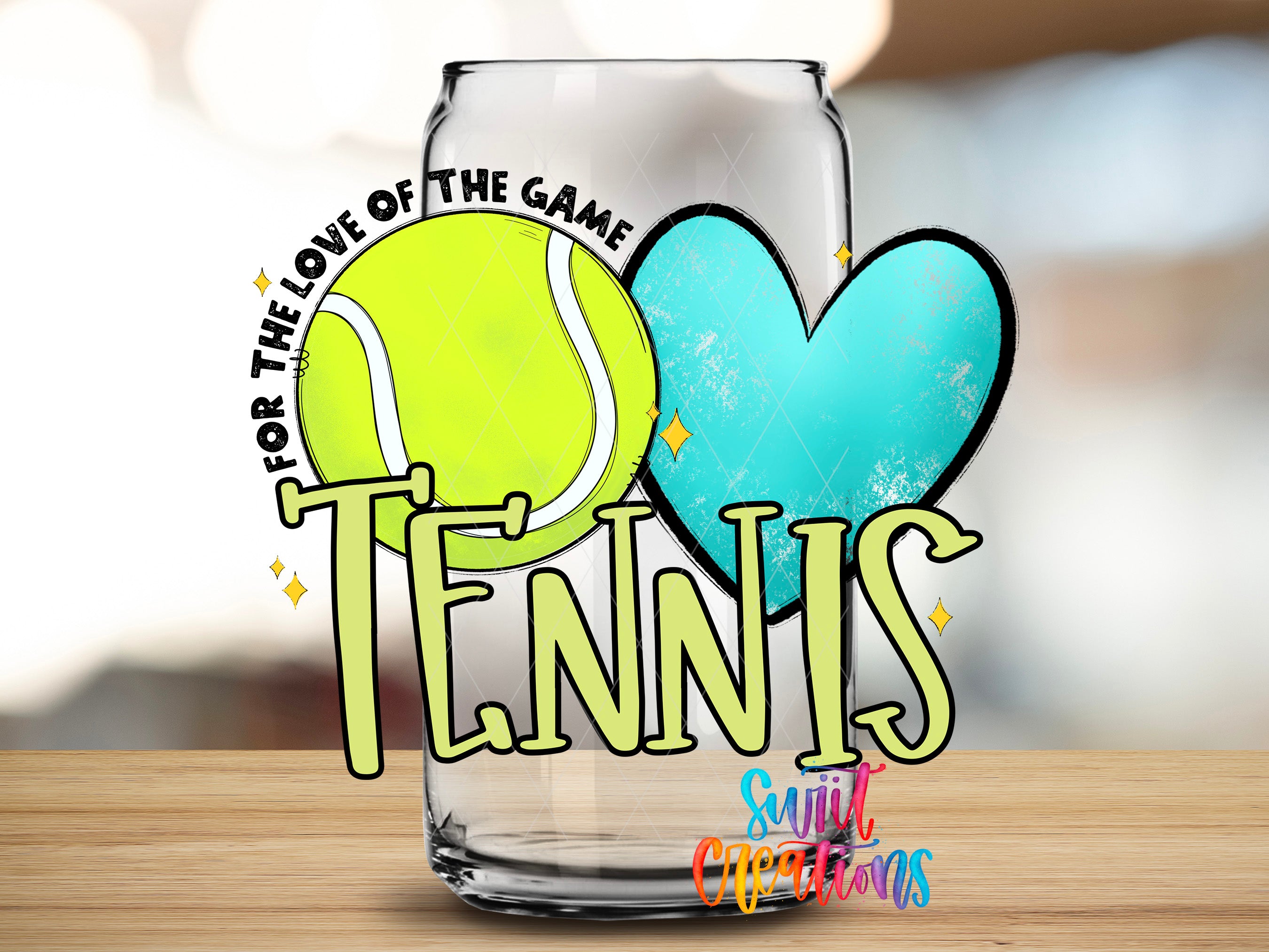 A glass can with a tennis ball and a heart on it, along with the text "TENNIS" and "Love of the Game" written on it.
