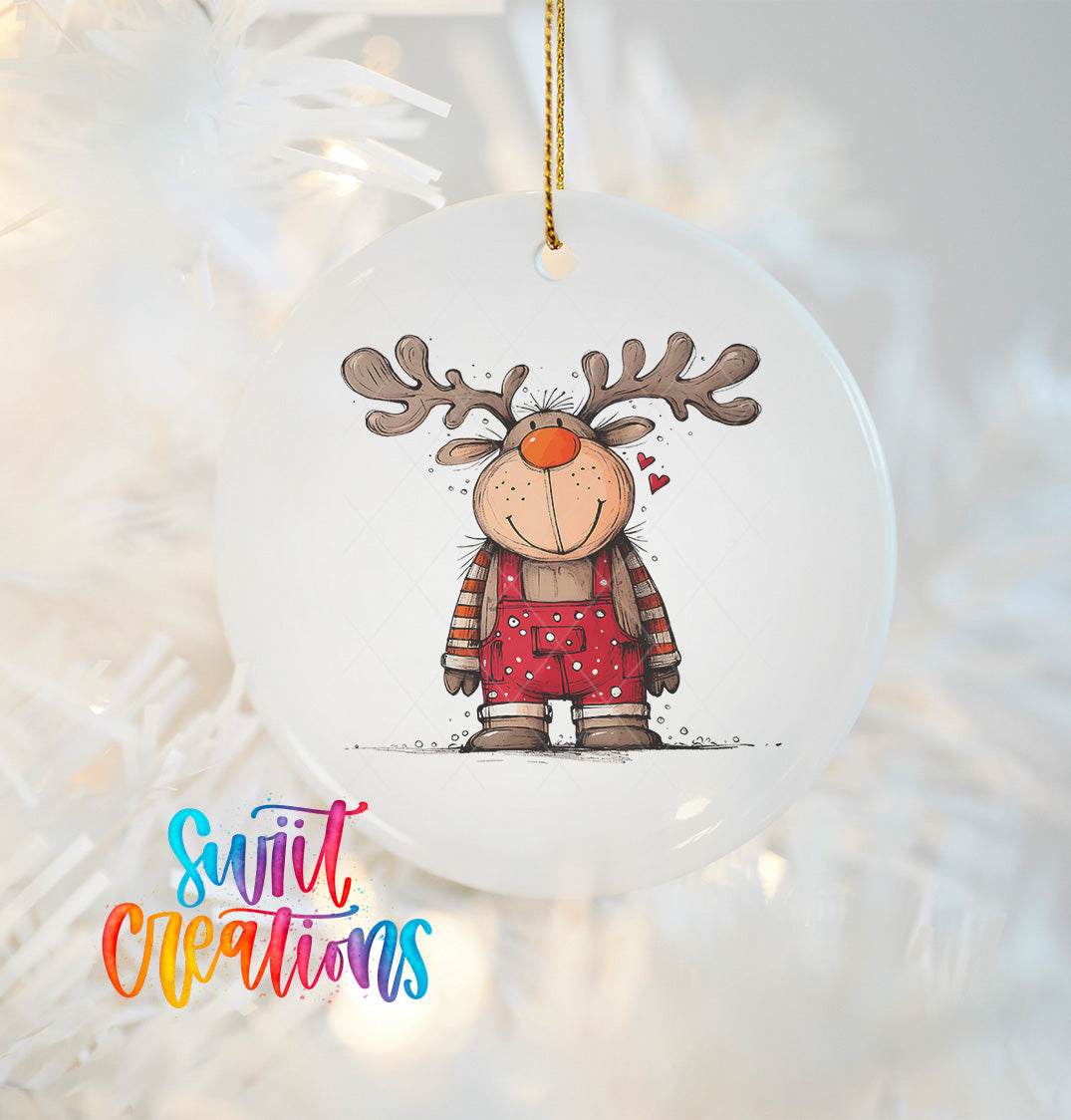 A white ornament featuring a cartoon reindeer wearing overalls and a red scarf, with a smiling expression.