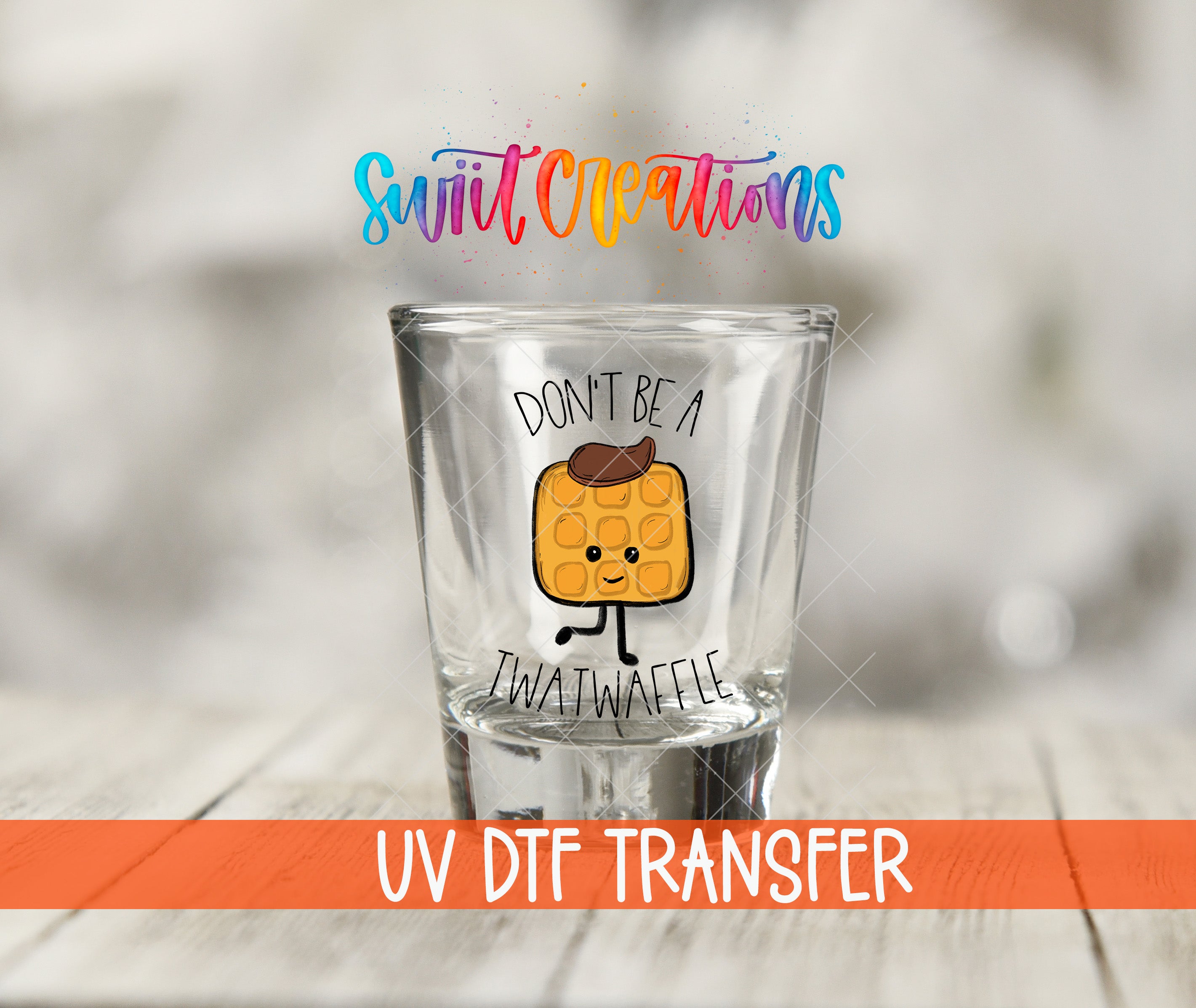 A shot glass with a cartoon waffle character on it, along with text that says "Don't be a Twatwaffle" and "UV Dtf Transfer".