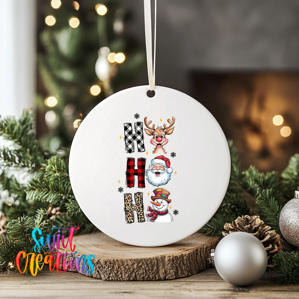 A white ceramic ornament with a Christmas tree in the background, featuring various holiday-themed elements such as reindeer, Santa Claus, and snowmen.