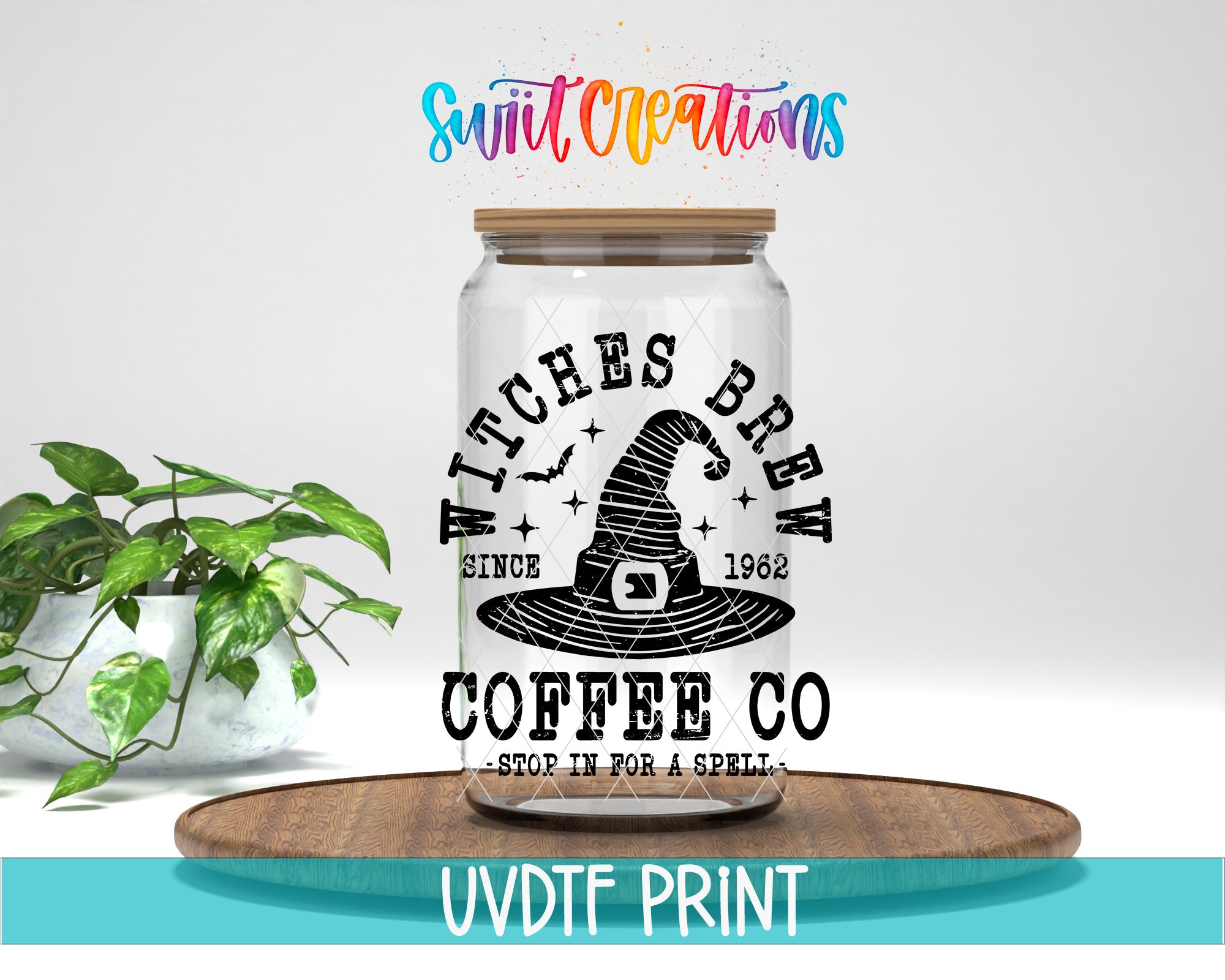 a glass jar with a label that says "WITCHES BREW" and "COFFEE CO" printed on it. The jar is placed on a wooden tray, and there is a potted plant in the background.