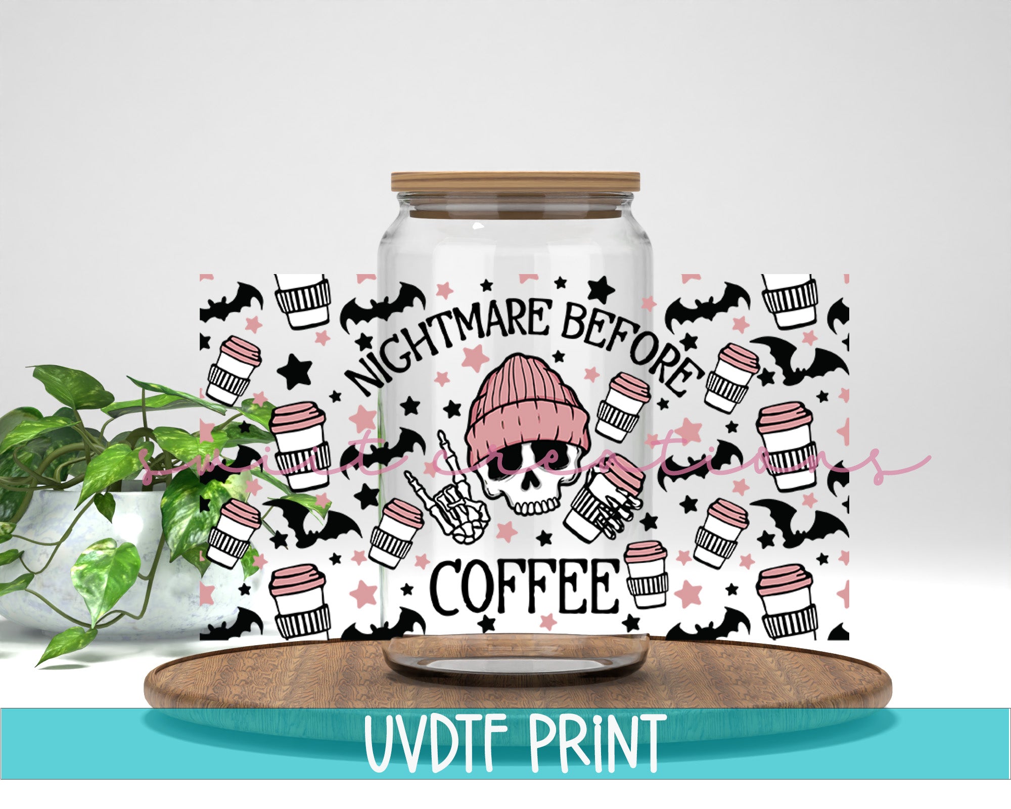 a jar filled with coffee next to a plant