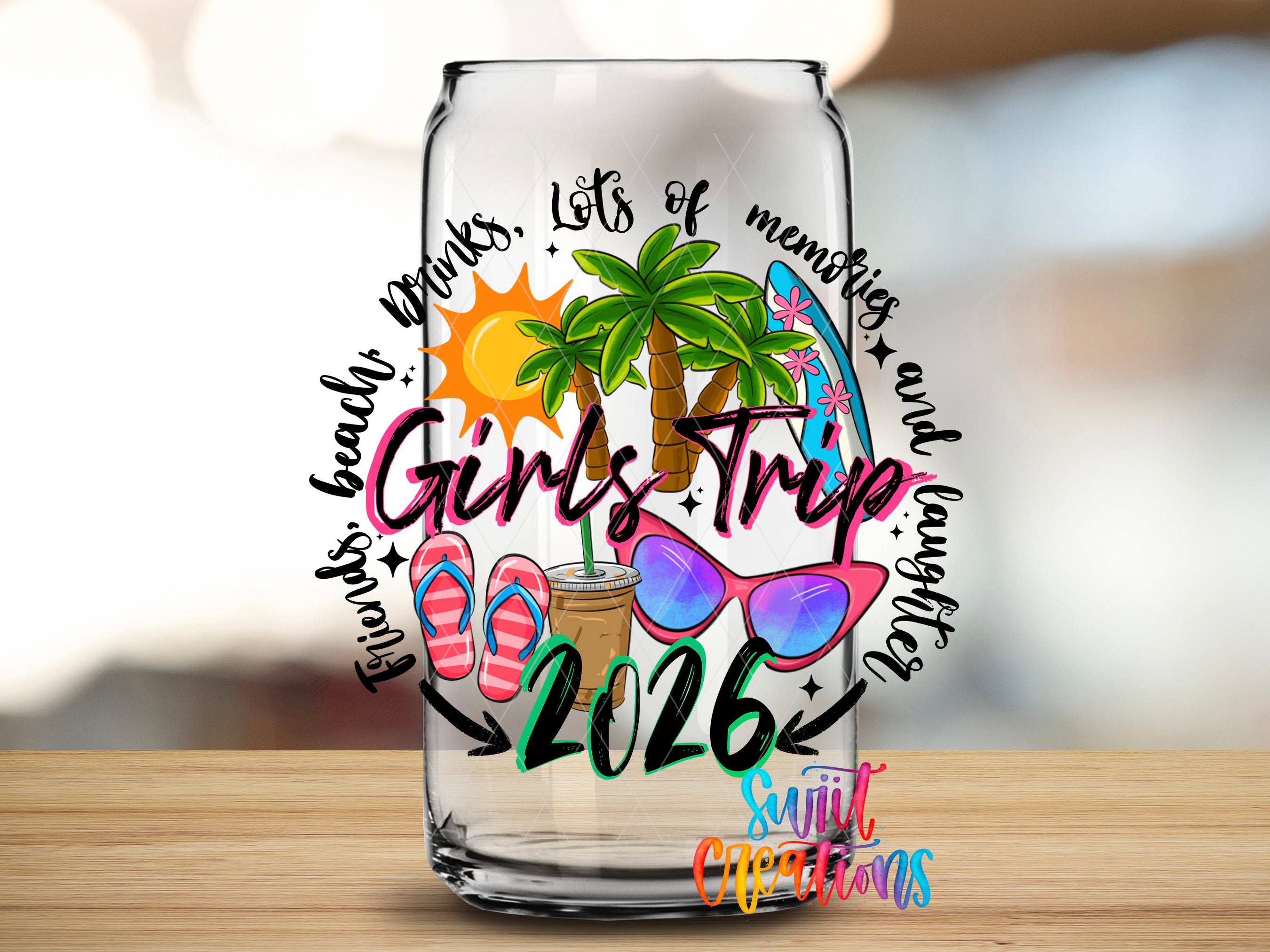 A glass can with a colorful design featuring a palm tree, sunglasses, and beach-themed elements, along with the text "Girls Trip" and "2016".