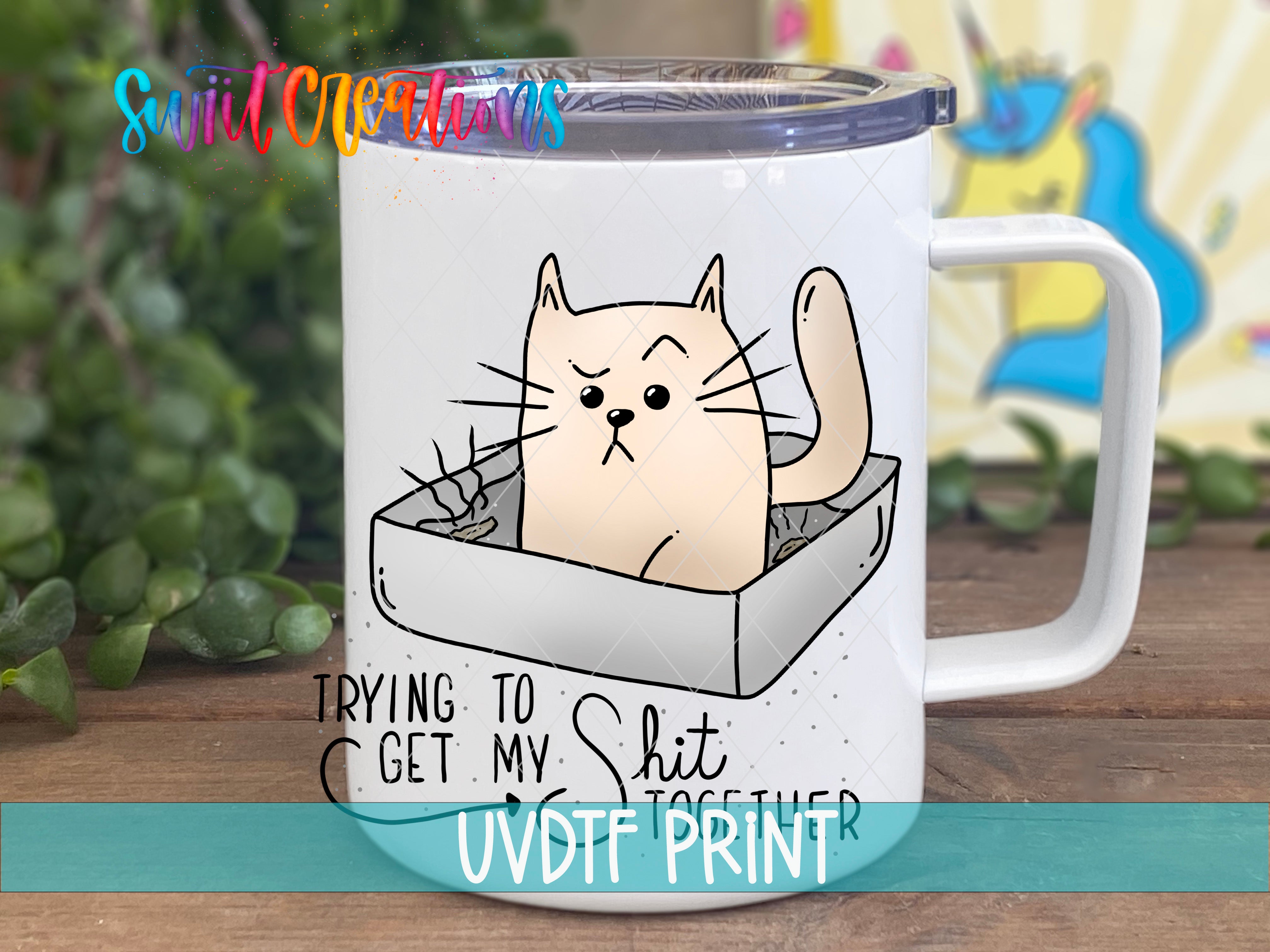 a white coffee mug with a cat inside of it