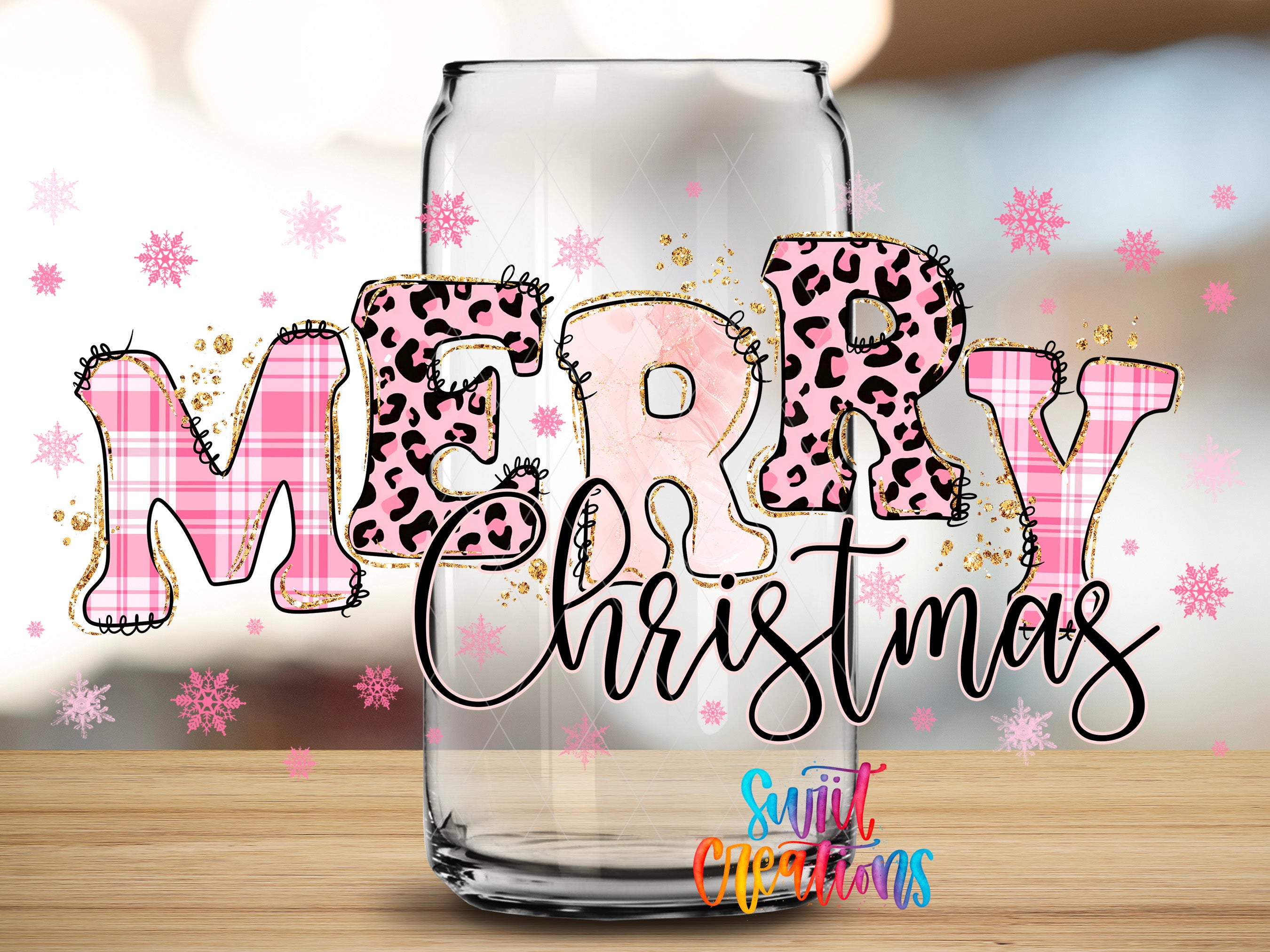 A glass can with the word "MERRY Christmas" written on it, surrounded by pink and black leopard print letters and snowflakes.