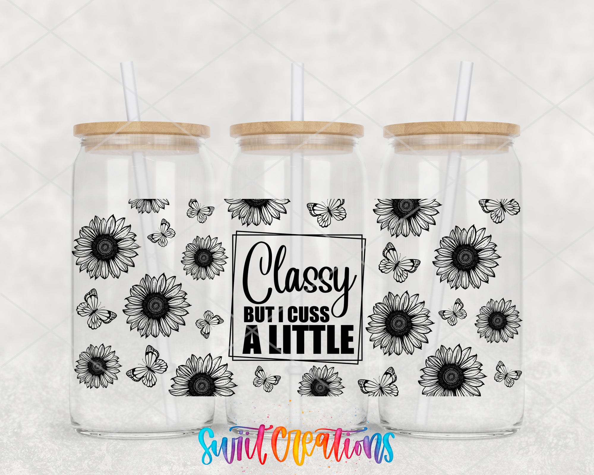 three clear glass tumblers with wooden lids, each adorned with a black and white floral design and butterflies. The text "Classy but I guess a little" is prominently displayed on the front of the tumblers.
