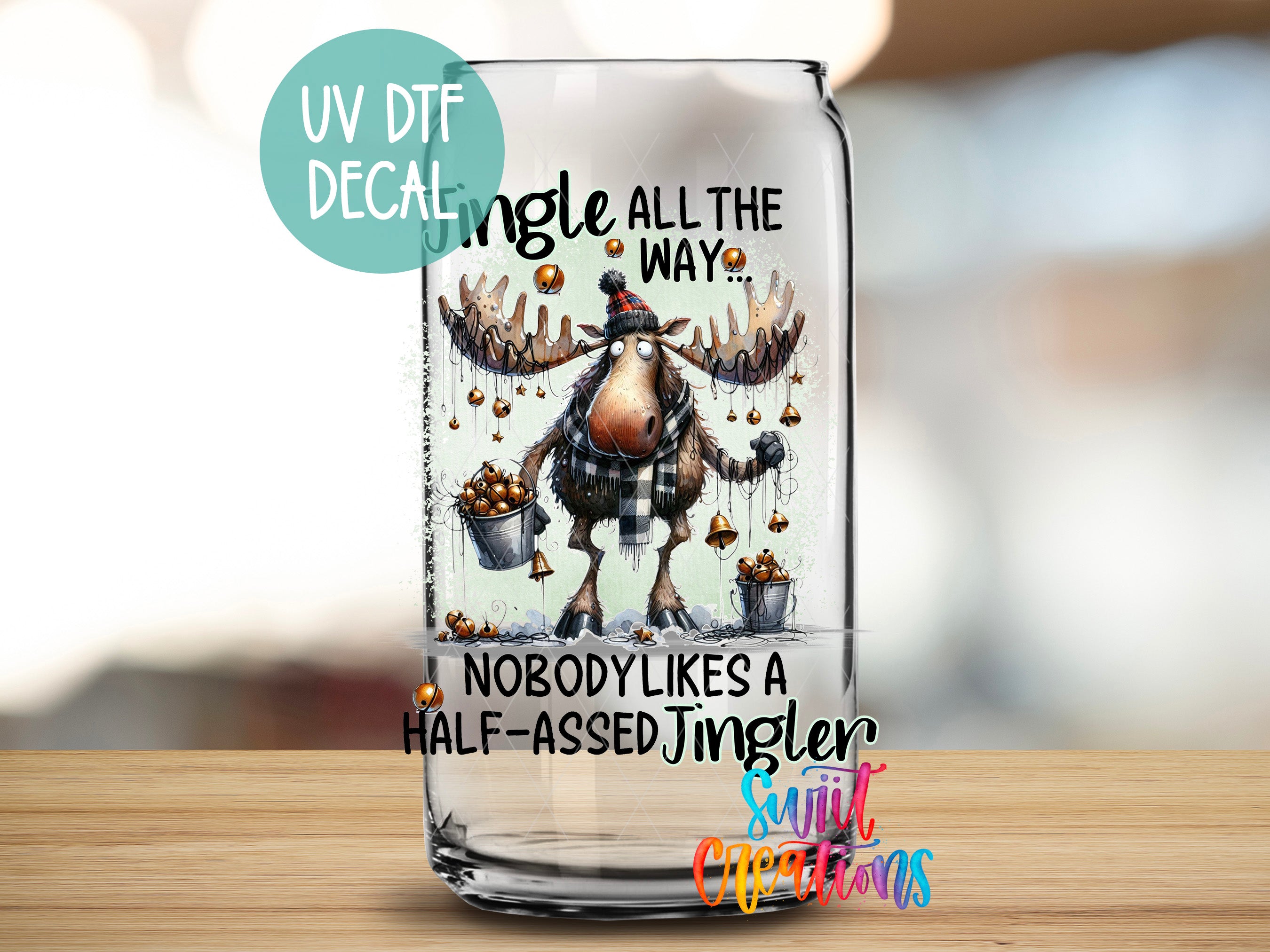 a glass with a picture of a moose on it