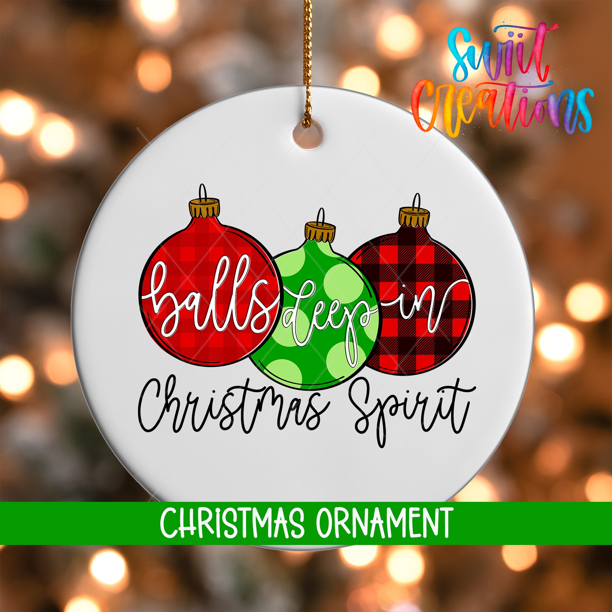 A white Christmas ornament with three colorful ornaments hanging from a string. The ornament has a message written on it, which reads "balls deep in Christmas spirit".