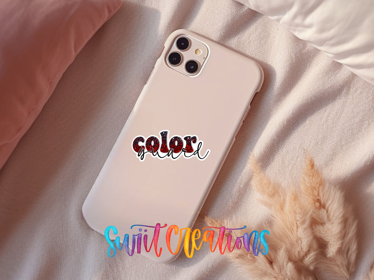 Red and black Color Guard sticker on a pink phone case resting on a bed
