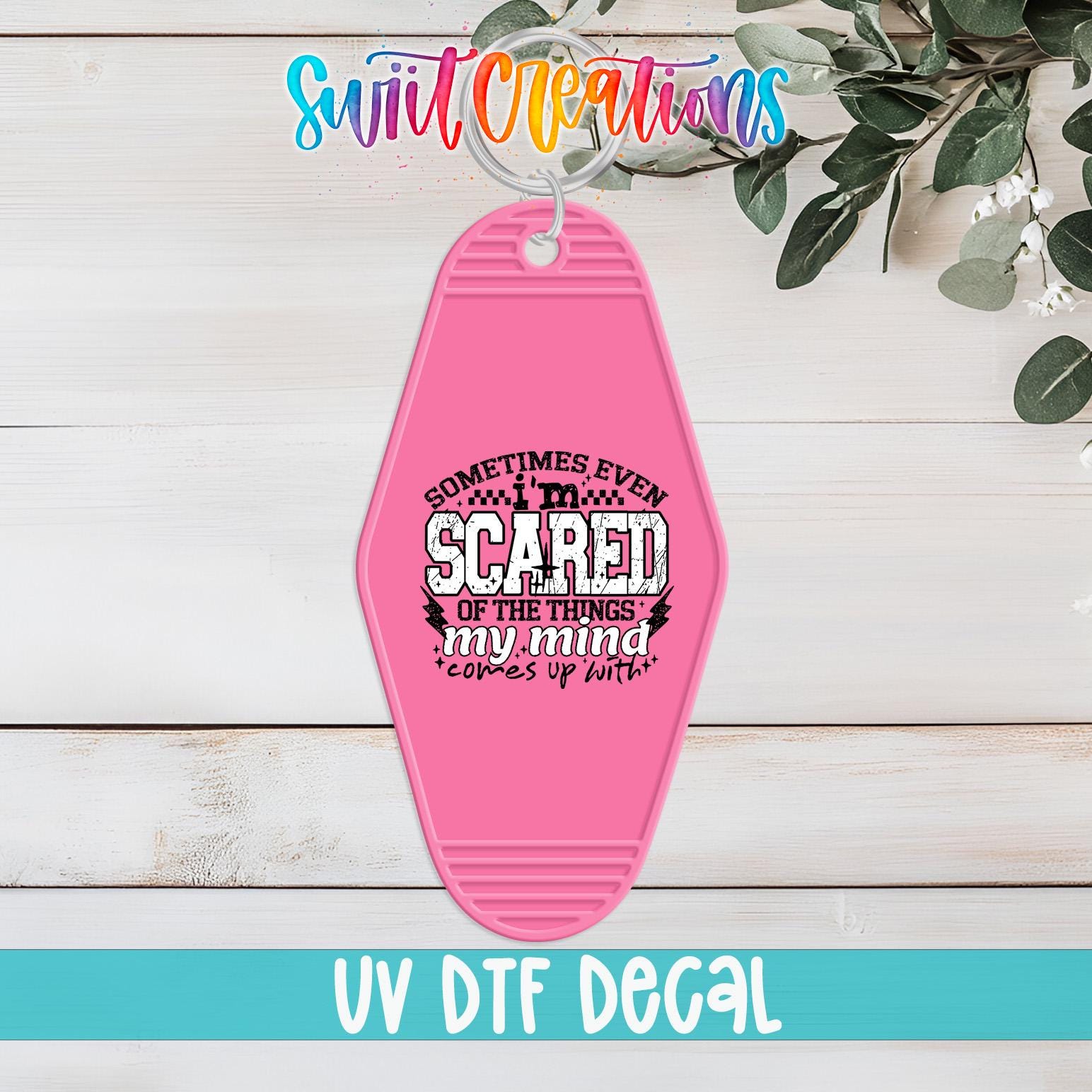 A pink keychain with a printed message that says "Sometimes even scared of the thought of my mind comes up with me"