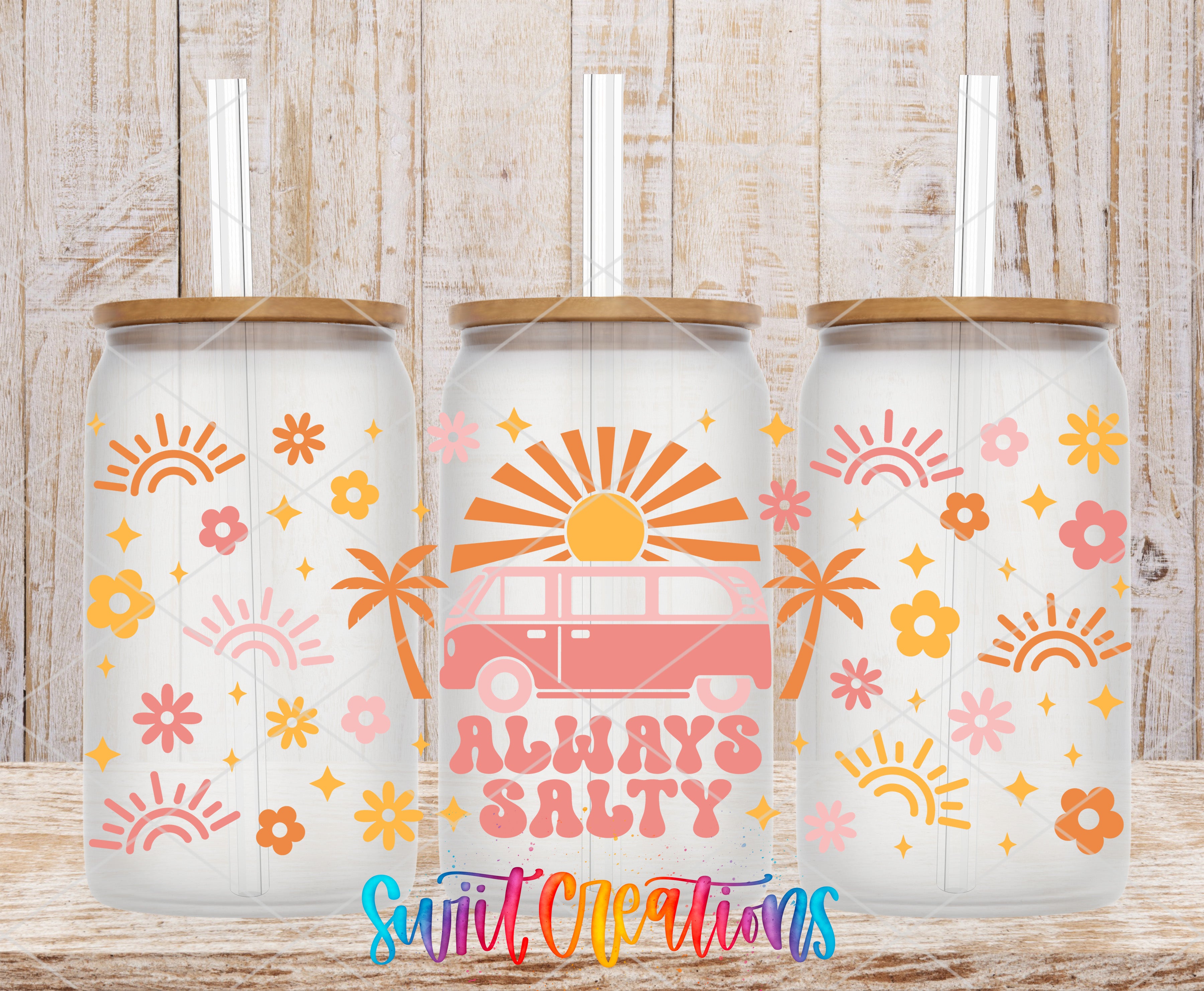 three glass tumblers with a retro-style design, including sun and flower motifs, and the text "Always Salty" printed on them.