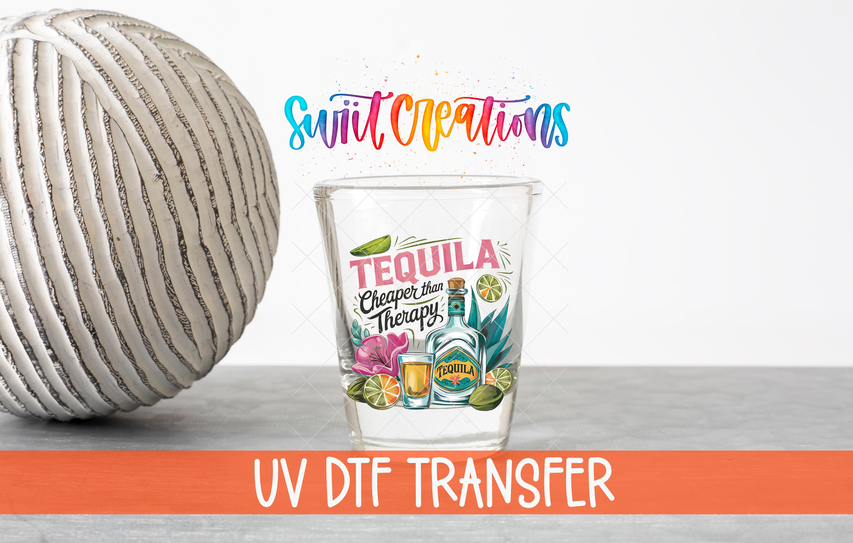 a glass with a tequila-themed design, accompanied by a ball and text related to UV DFT transfer.