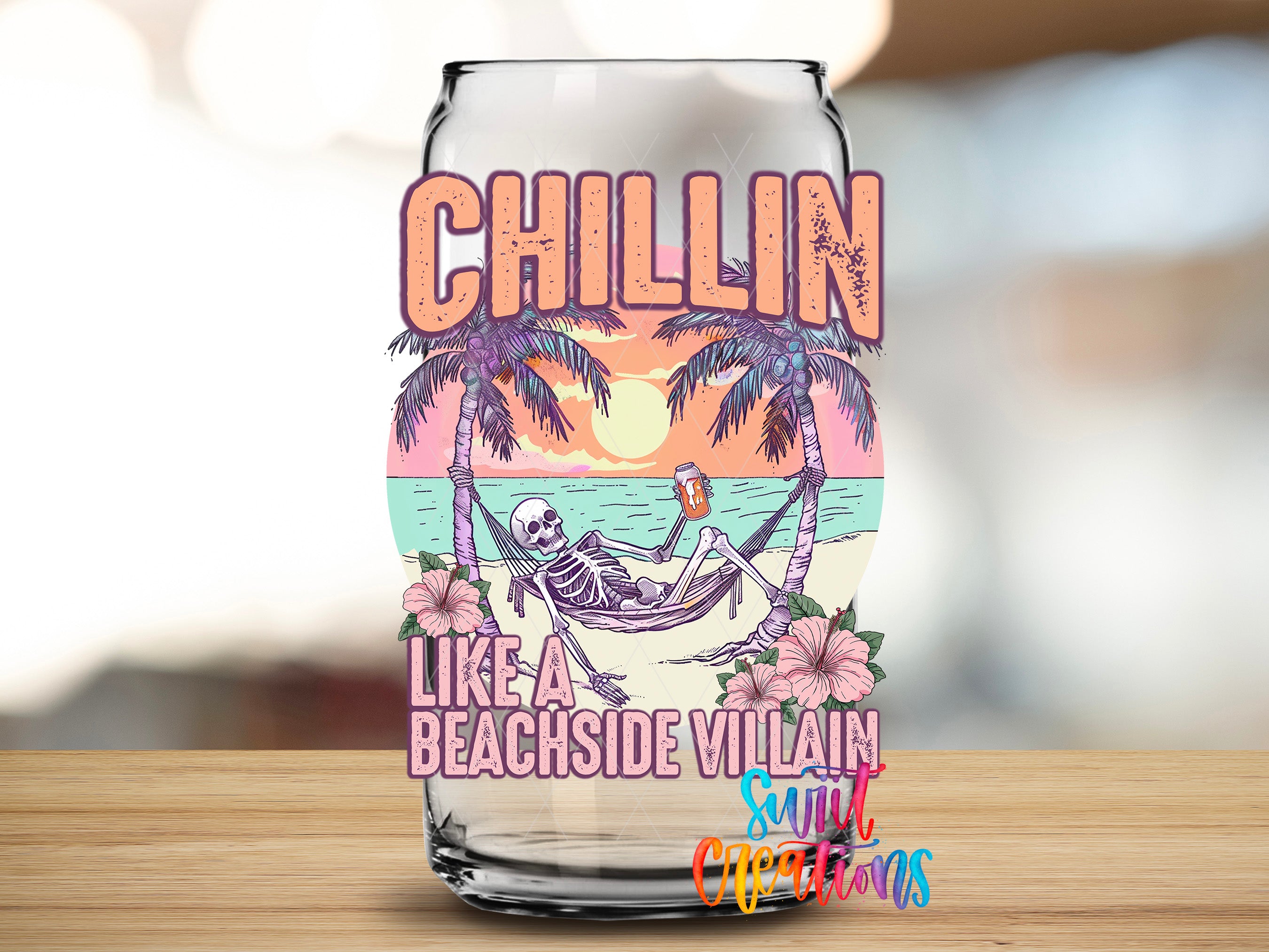 A glass with a colorful design featuring a skeleton in a hammock, palm trees, and a sunset. The text on the glass reads "CHILLIN LIKE A BEACHSIDE VILLAIN SULT CREDITS".