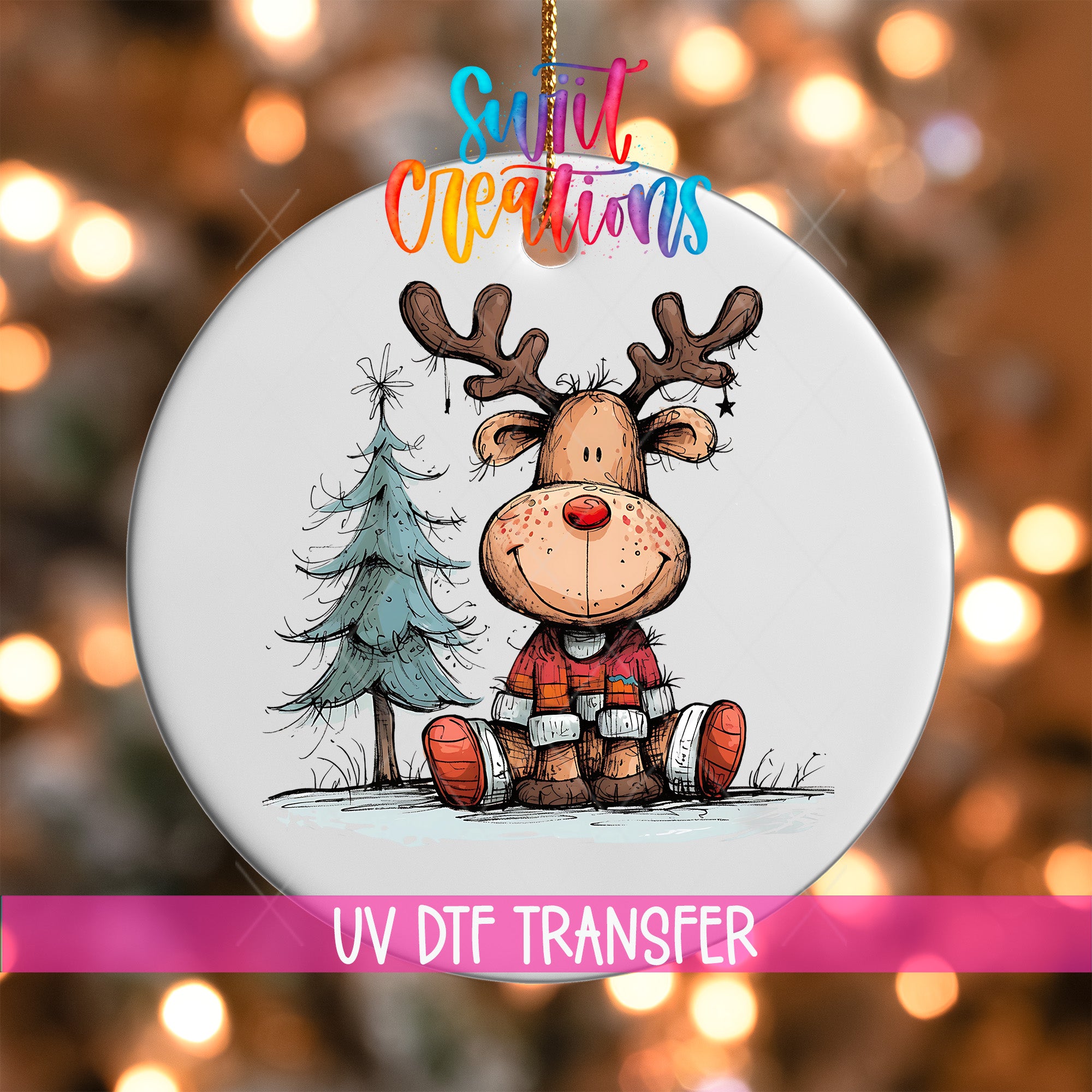 A white ornament with a cartoon reindeer and a Christmas tree, with the text "Sweet Creations" and "UV Dtf Transfer" printed on it.