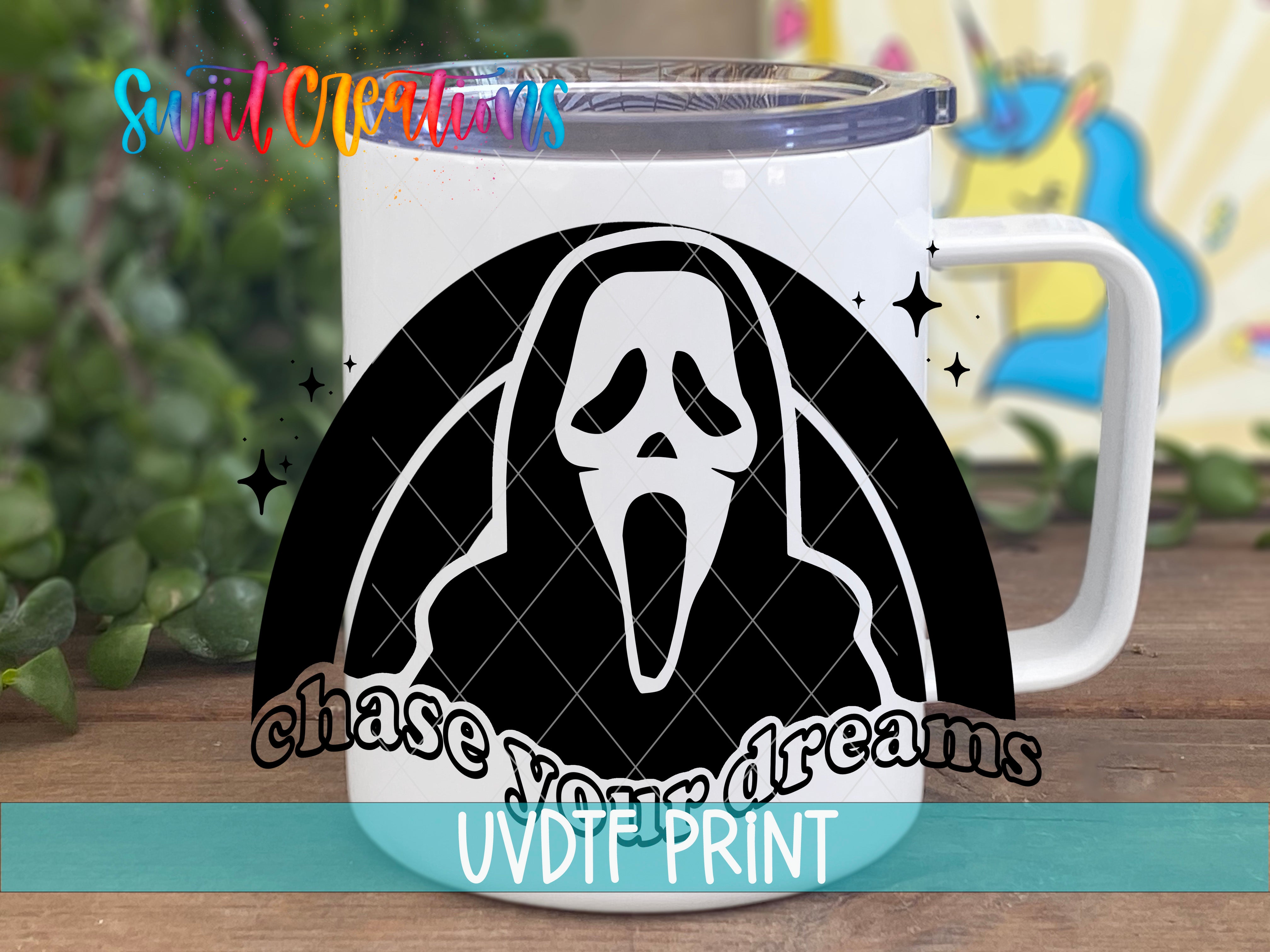 a white coffee mug with a black and white image of a ghost