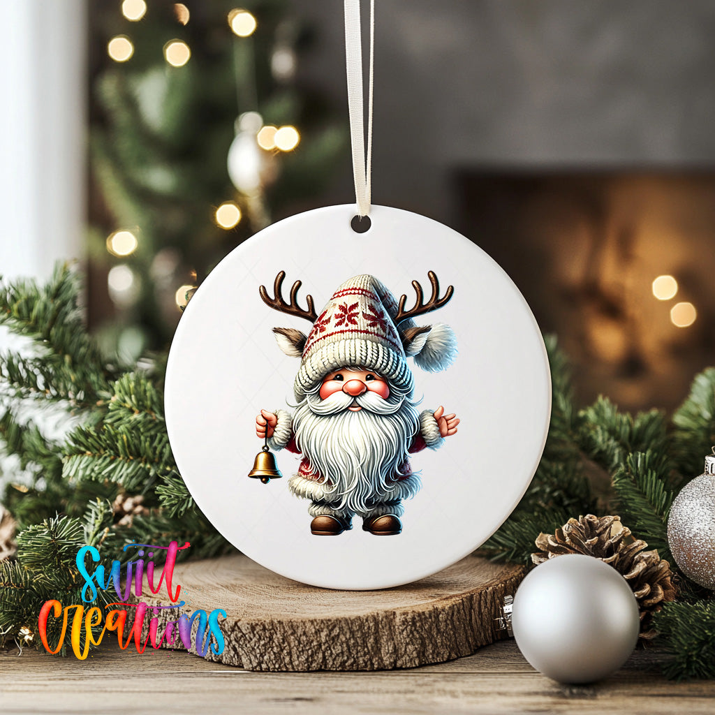 A white ceramic ornament featuring a gnome with antlers and a bell, surrounded by Christmas decorations and greenery.