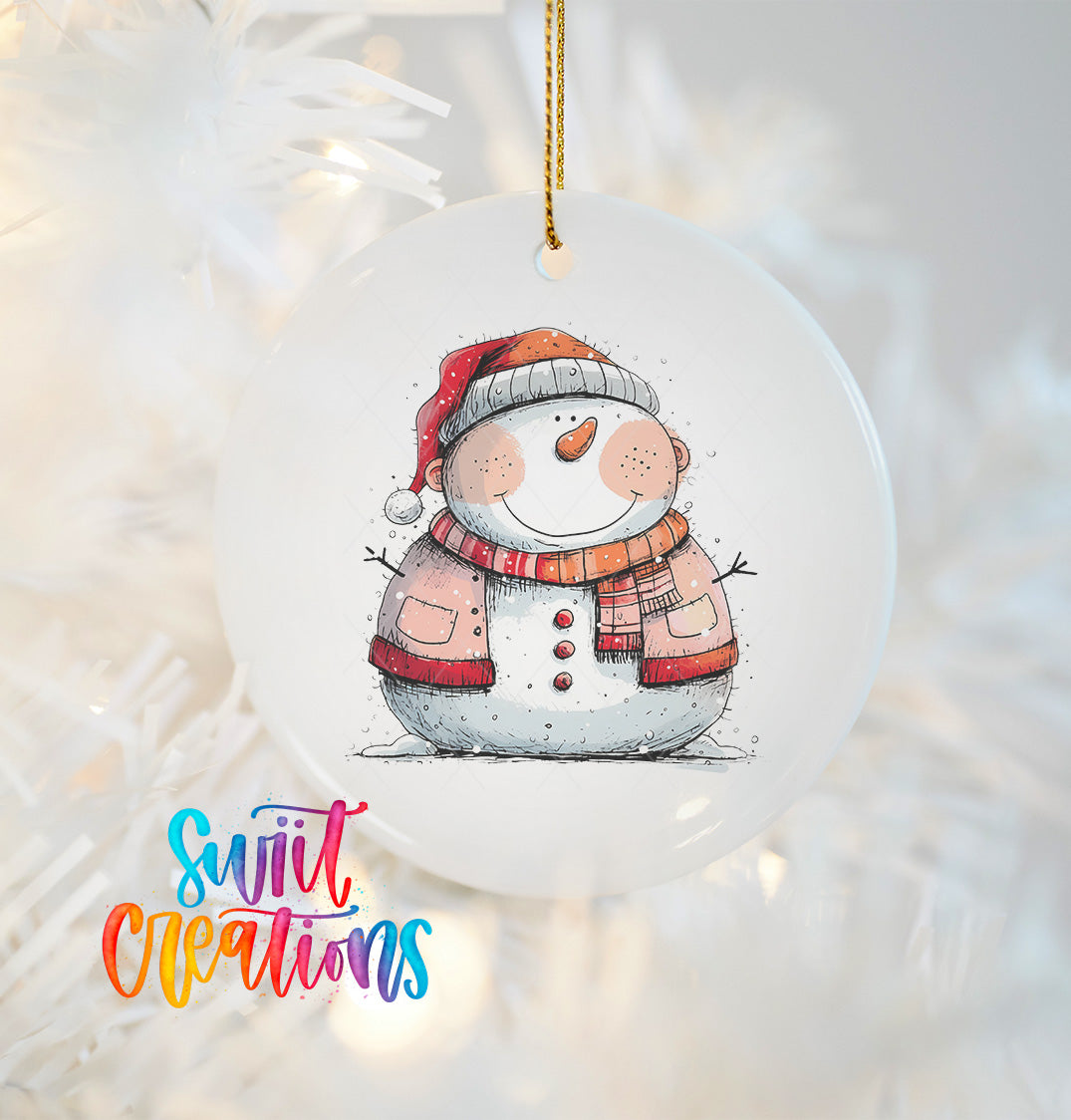 A white snowman ornament with a red scarf and hat, smiling and wearing a red scarf, is hanging on a Christmas tree.
