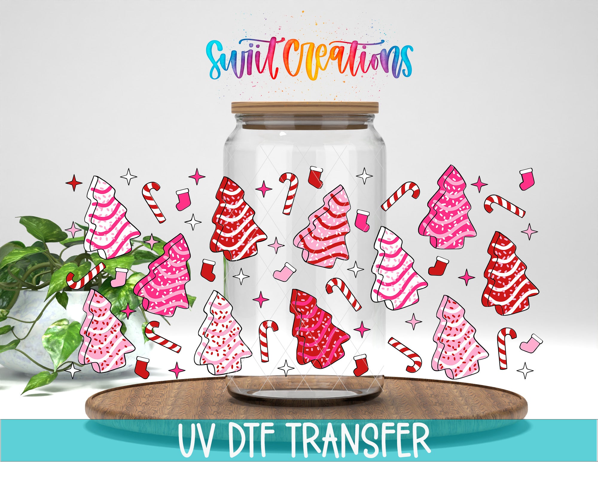 a glass jar with a lid, decorated with various Christmas-themed elements such as trees, candy canes, and stockings. The jar is placed on a wooden surface, and there is a plant in the background. The image also includes text that reads "Swift Creations UV Dtf Transfer".