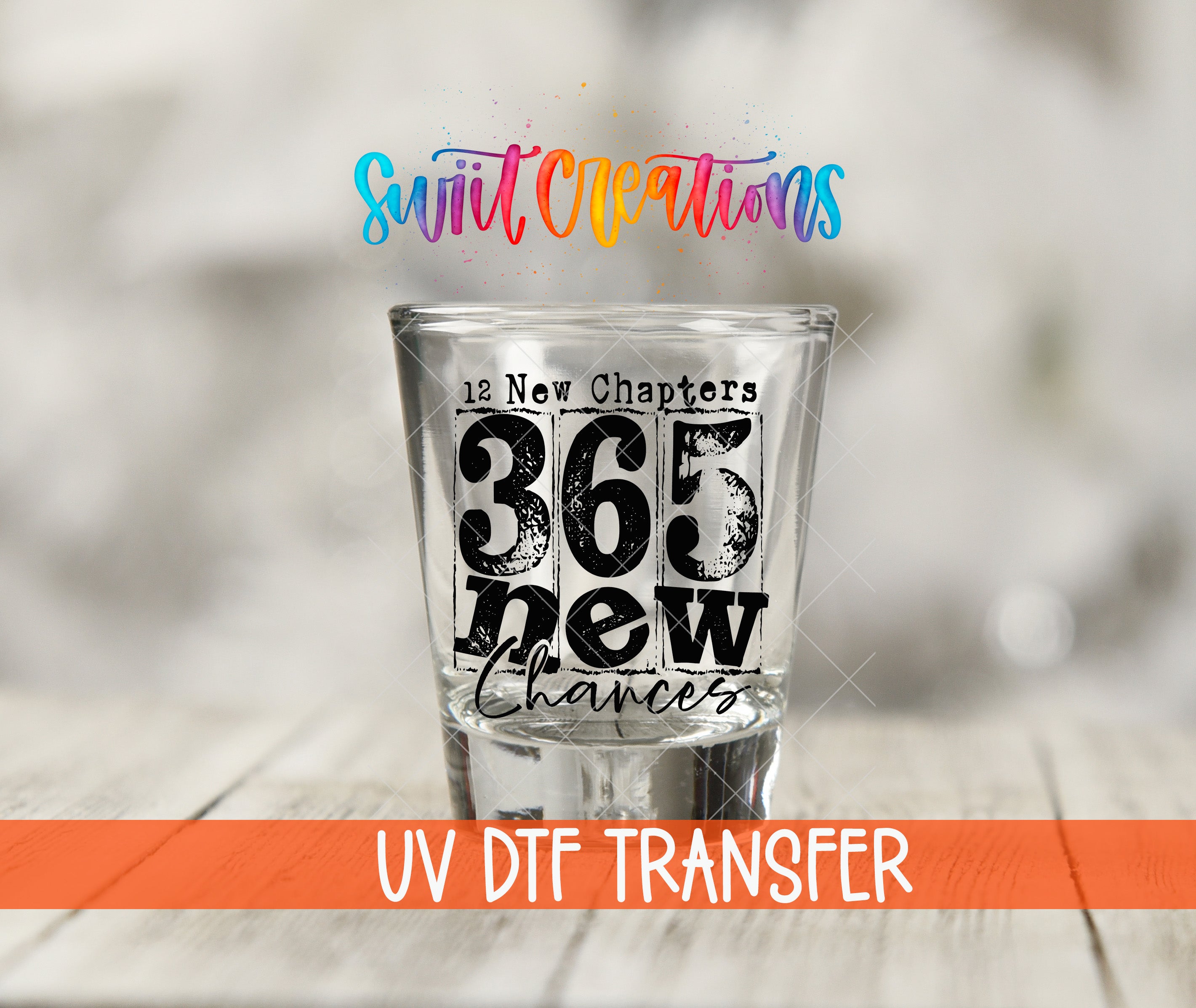 a shot glass with text and numbers on it, placed on a wooden surface.