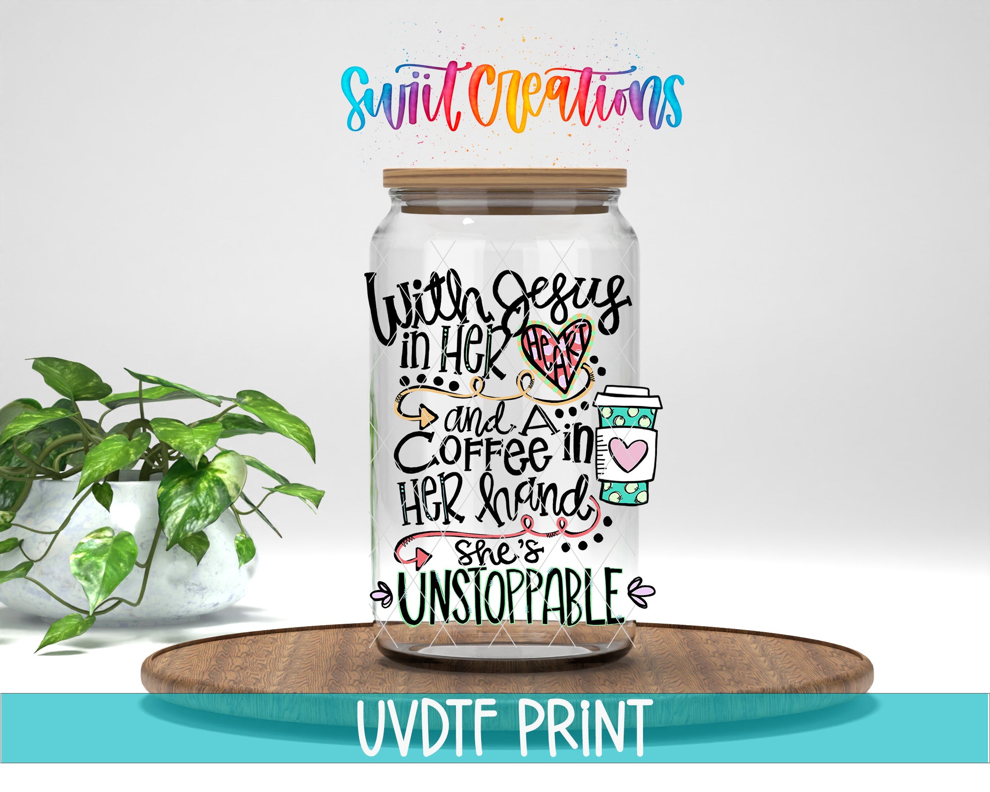 A glass jar with a lid, decorated with colorful text and illustrations, placed on a wooden surface.