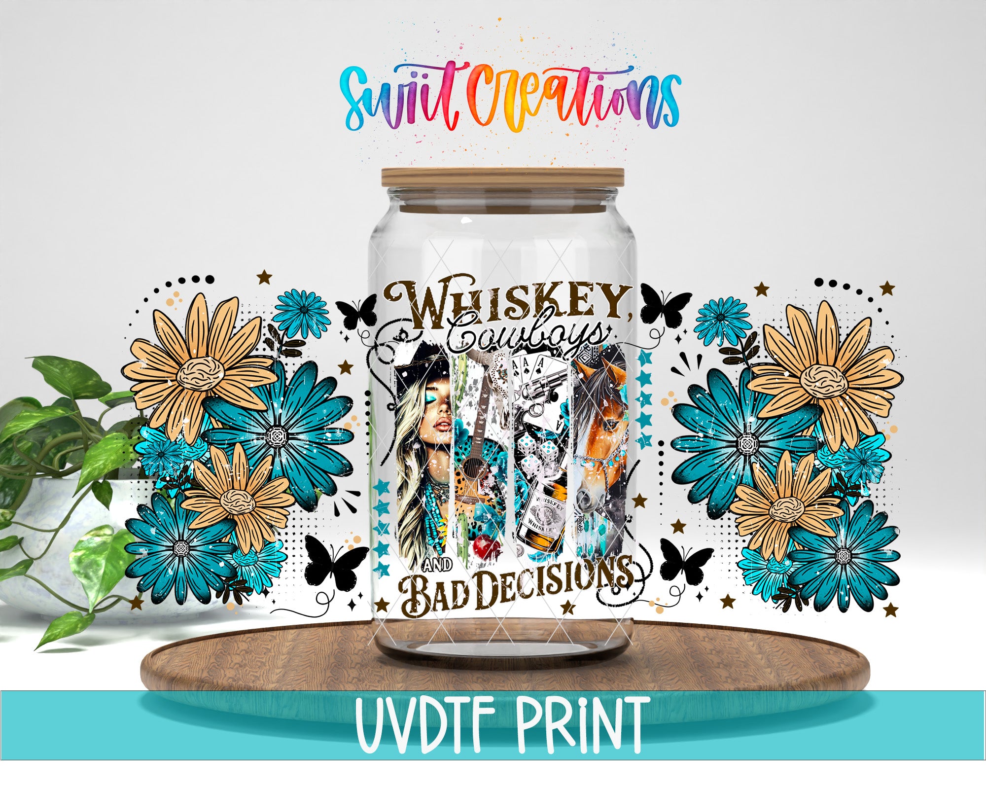 A glass jar with a floral design and the text "Whiskey Cowboys Bad Decisions" printed on it, placed on a wooden surface.