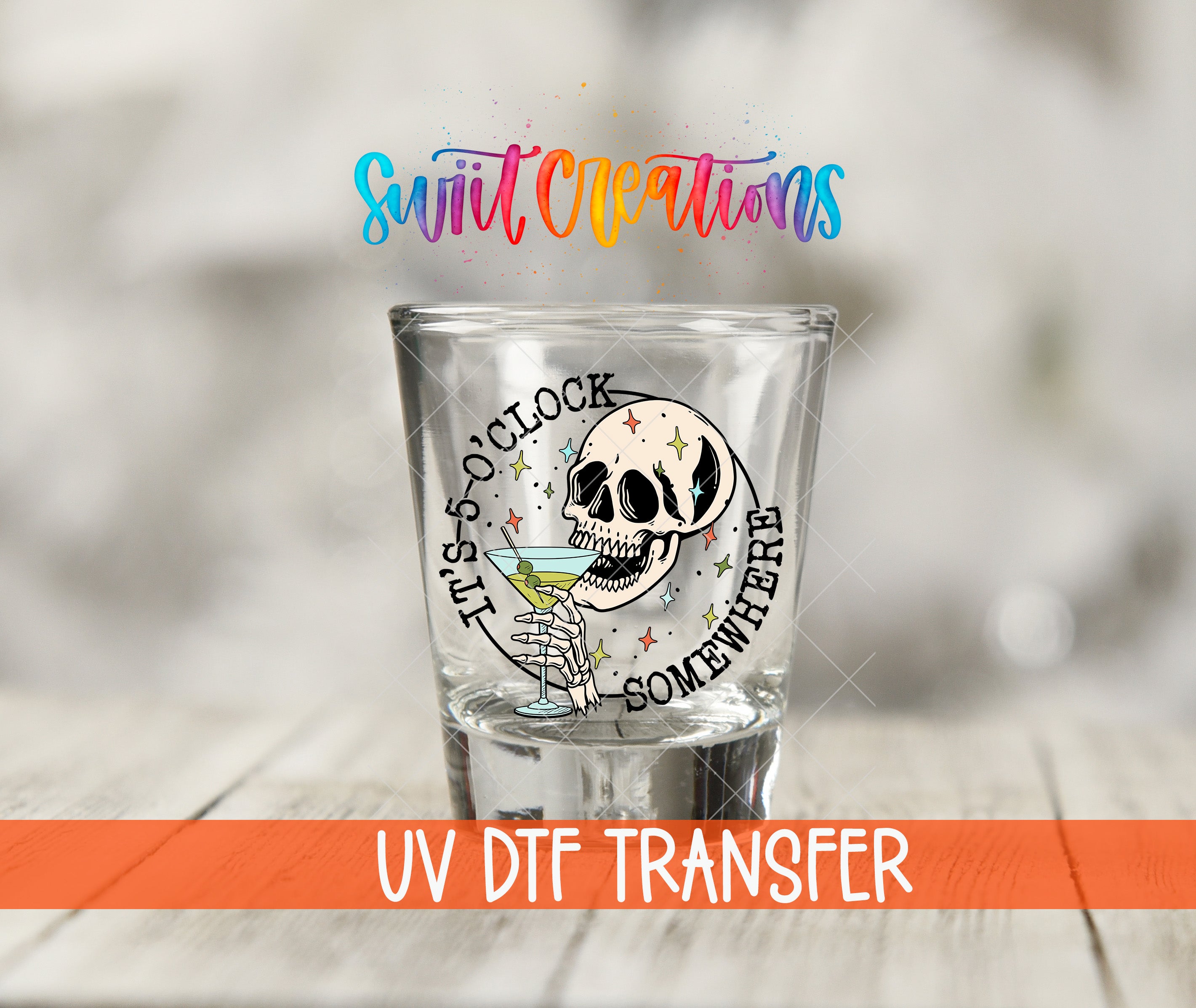 A shot glass with a skull design and text, along with a rainbow-colored text logo above it.