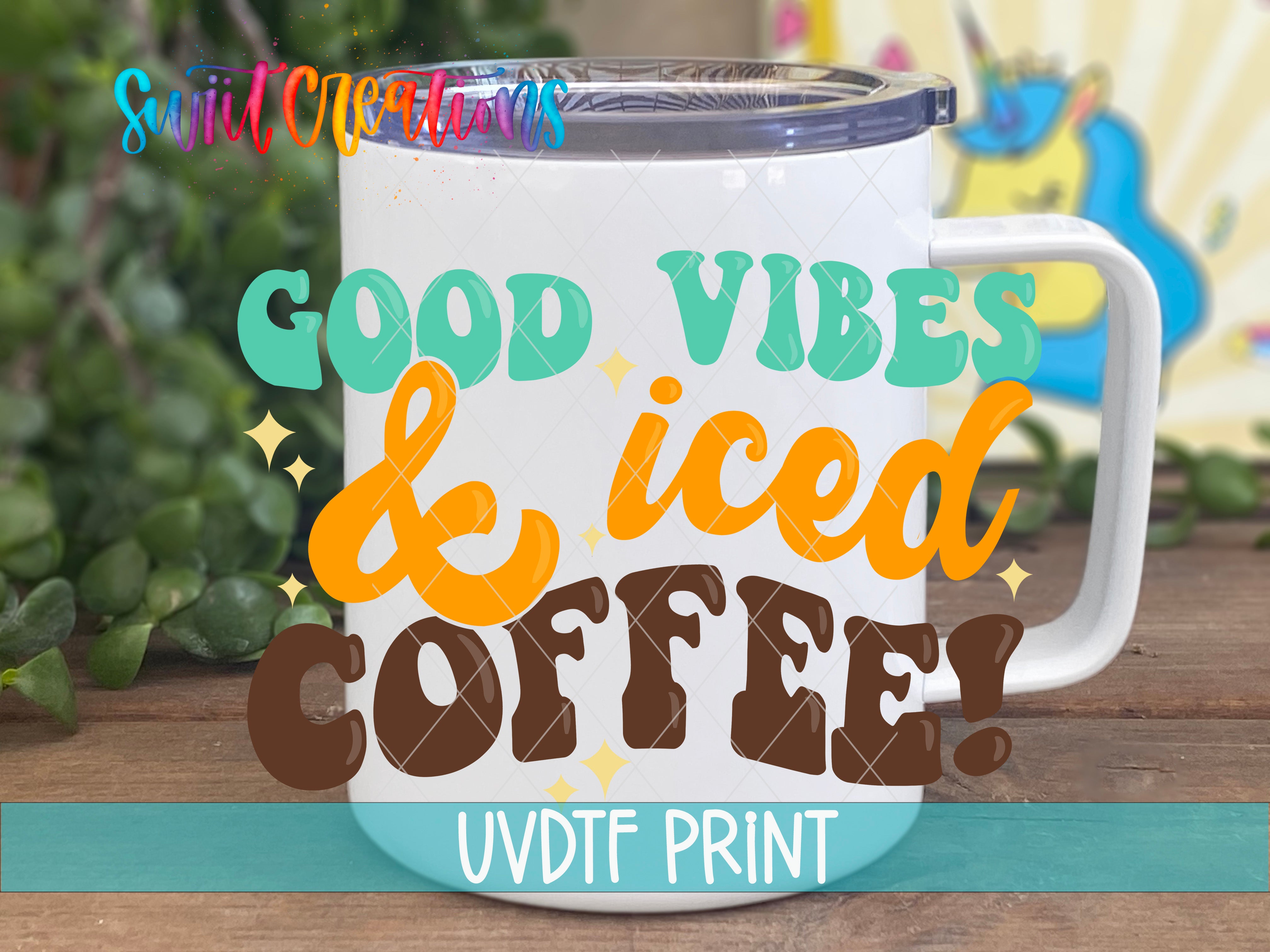 A white mug with a handle and a lid, featuring colorful text that says "GOOD VIBES & Iced COFFEE!"