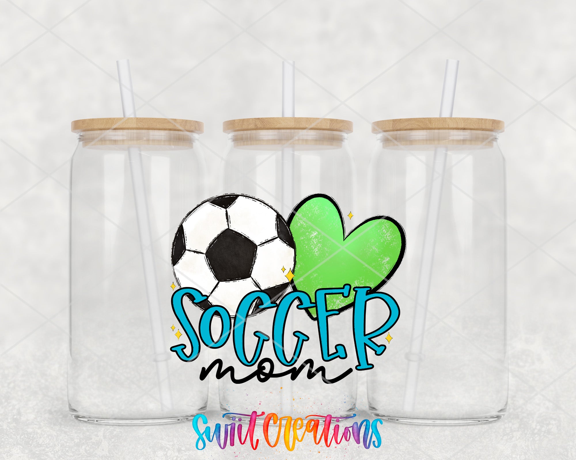 three clear glass jars with wooden lids, each with a straw, and a soccer ball and a green heart design in the center. The text "SOCCER mom" is displayed in a colorful, stylized font, and the phrase "Swit Creations" is written at the bottom of the image.