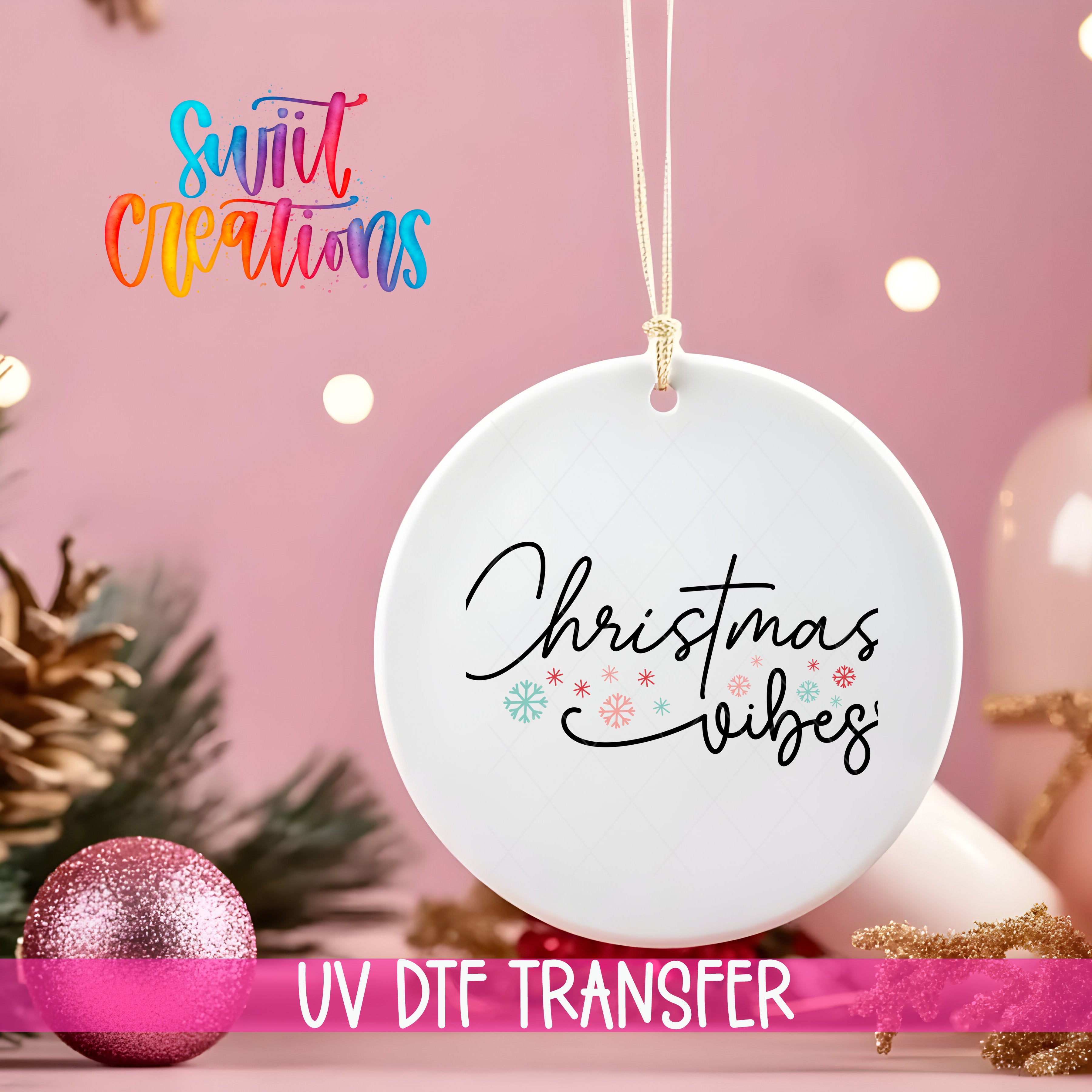 A white ornament with the text "Christmas vibes" is hanging on a string against a pink background, with Christmas decorations and a pink glitter ornament visible in the background.