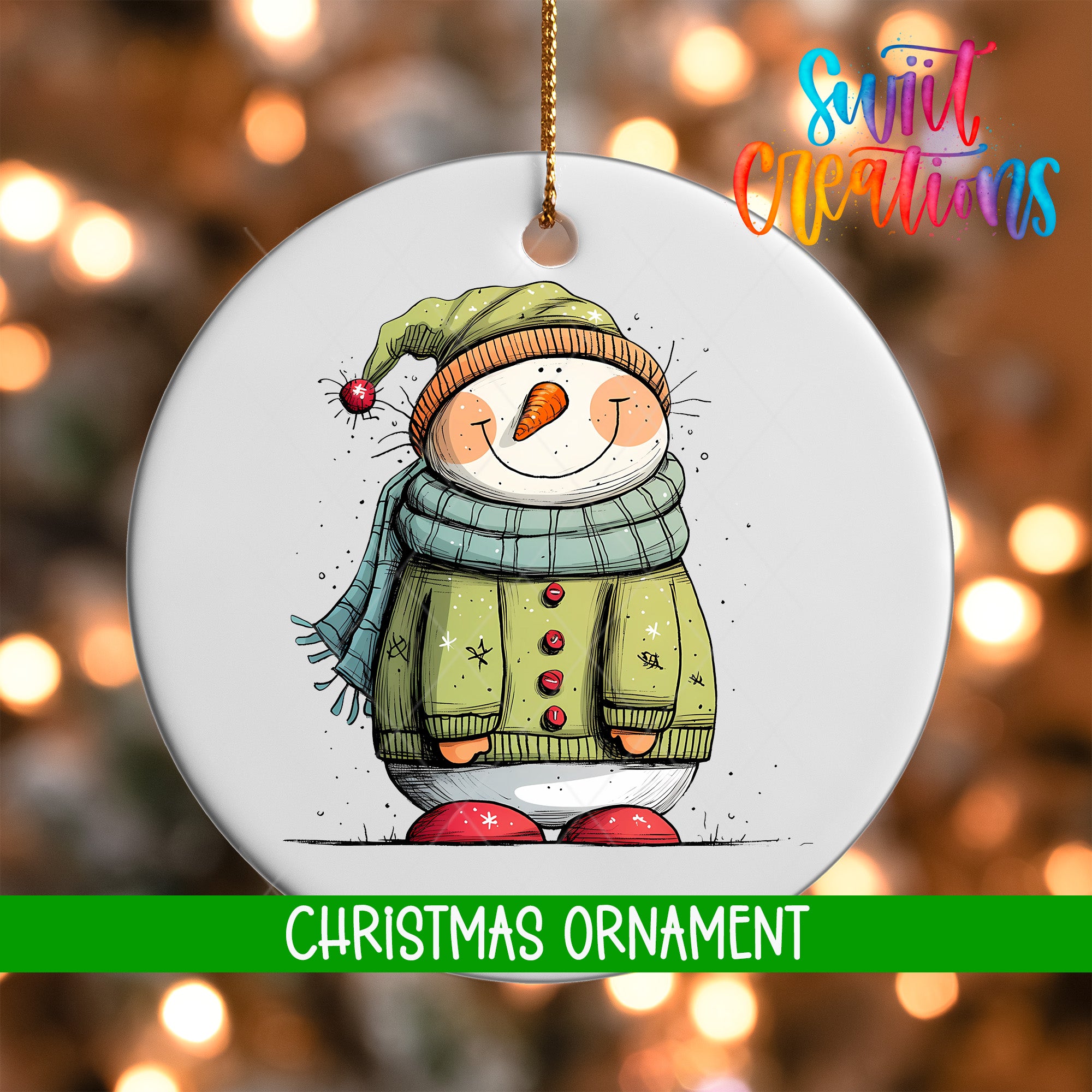 A white Christmas ornament featuring a smiling snowman wearing a green sweater and hat, with a red scarf and red shoes.