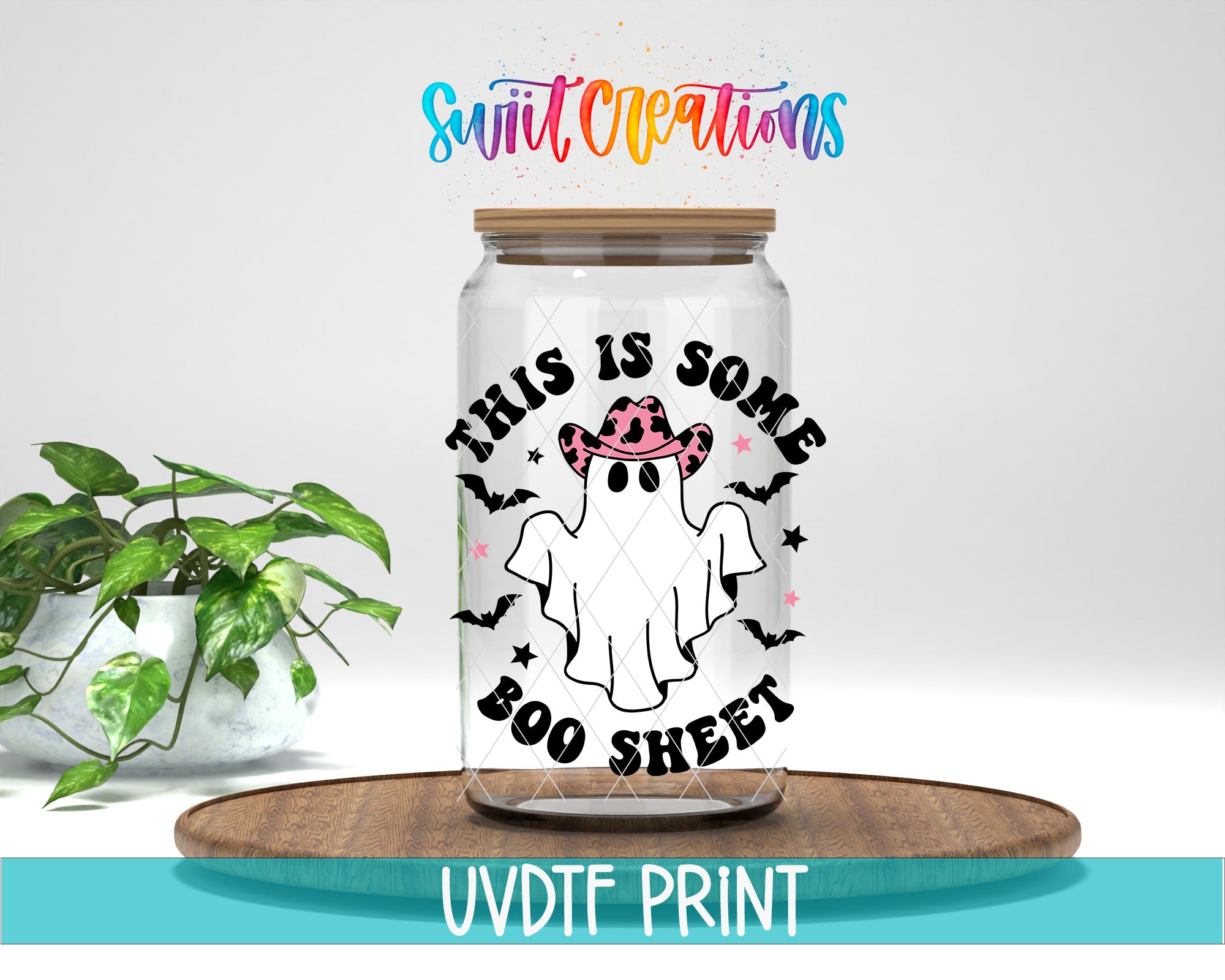 a glass jar with a Halloween-themed design, including a ghost, a cowboy hat, and the text "This is some BOO sheet".