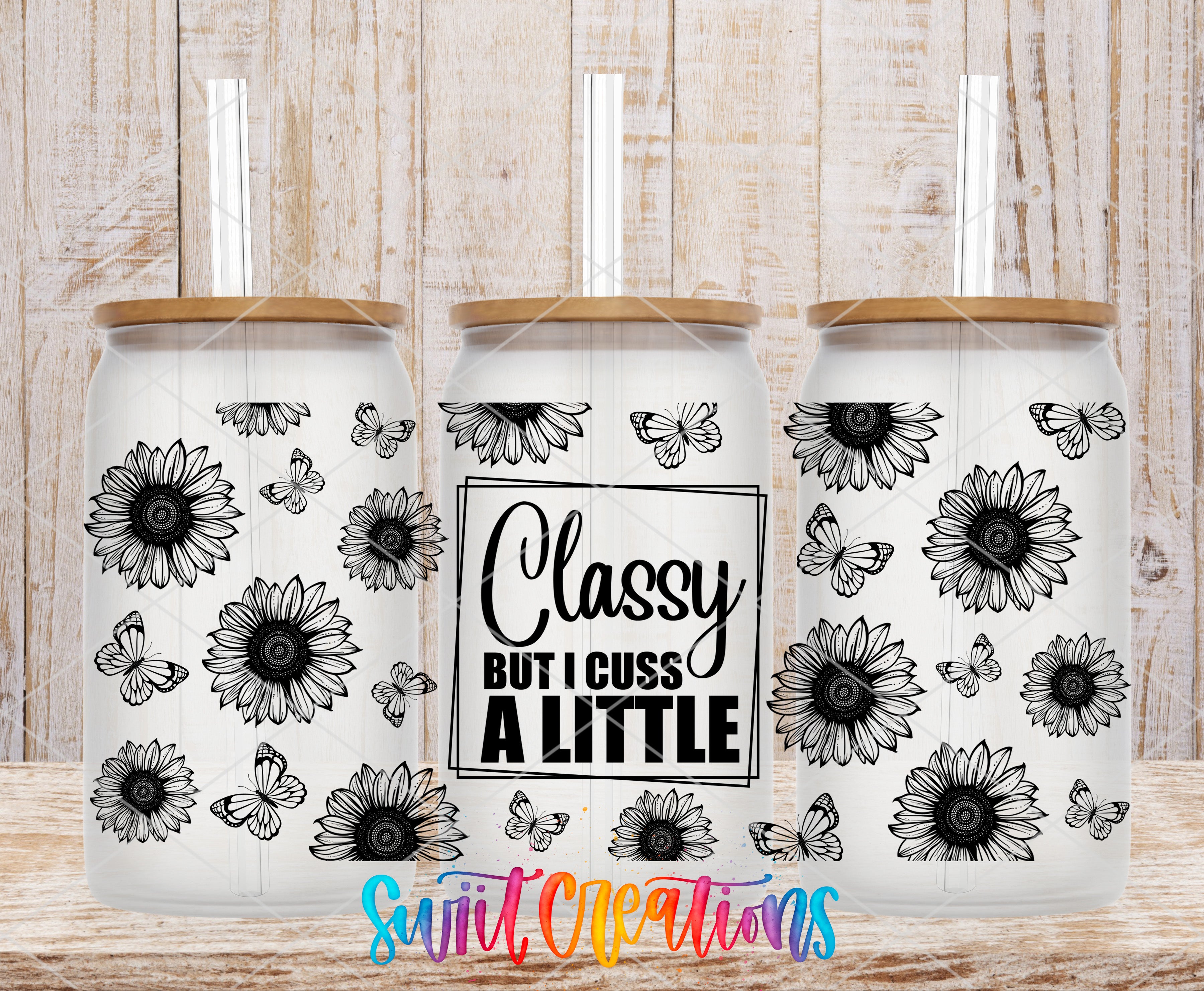 three glass tumblers with a floral design and a text message printed on them.