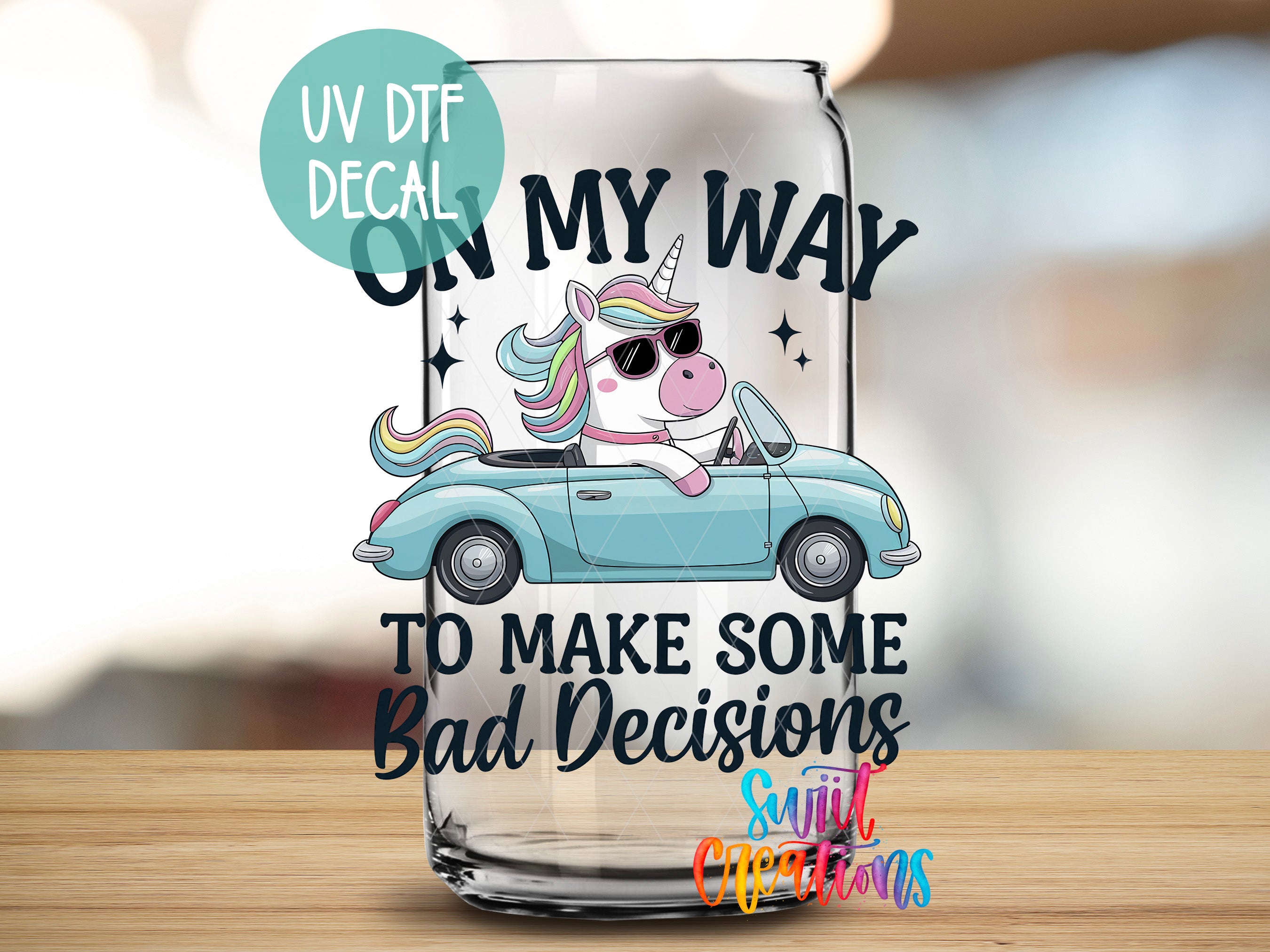 a glass with a picture of a unicorn driving a car